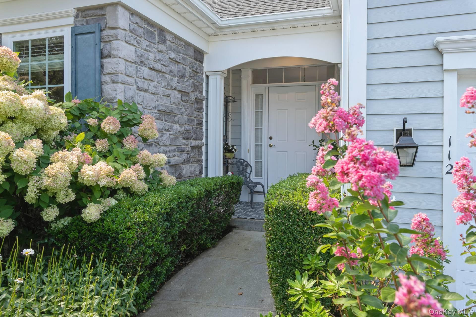 A highly sought-after Southampton model in the prestigious Westhampton Pines, a 55+ gated community is new to the market! This desirable corner-unit condo is set in a quiet, private location within the community and offers an exceptional blend of comfort, style, and convenience.  The home features three bedrooms and three full baths including a primary suite on the main level, along with a second bedroom and bath. Upstairs, a versatile loft provides a third bedroom, full bath, and den--an ideal space for guests.  A welcoming foyer opens into a vaulted living room with gas fireplace and adjoining dining room.  A sunlit kitchen offers granite counters, gas stove with microwave, breakfast bar, dining area, custom built-in wall unit and butler's pantry.  This unit has a full basement with a walkout slider to the backyard. The laundry room, complete with scrub sink, washer and dryer, leads directly into an oversized two-car garage with extra refrigerator and shelving.  For outdoor living, enjoy a terrace with retractable awning overlooking landscaped grounds--perfect for morning coffee or evening cocktails!  A lower-level brick patio offers an additional spot for barbecuing and relaxing.  The resort-style clubhouse has weekly activities and social events. Amenities include indoor and outdoor heated pools, Jacuzzi, fitness center, card room, library, bocce, tennis, and pickleball courts. Homeowners also enjoy beach access to Rogers Beach in Westhampton Beach and Pikes Beach on Dune Road.  This is an exceptional opportunity to enjoy a maintenance-free lifestyle in one of the most desirable active adult communities in the Hamptons.