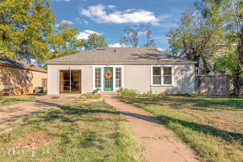 View of front of property featuring roof with shingles and entry steps