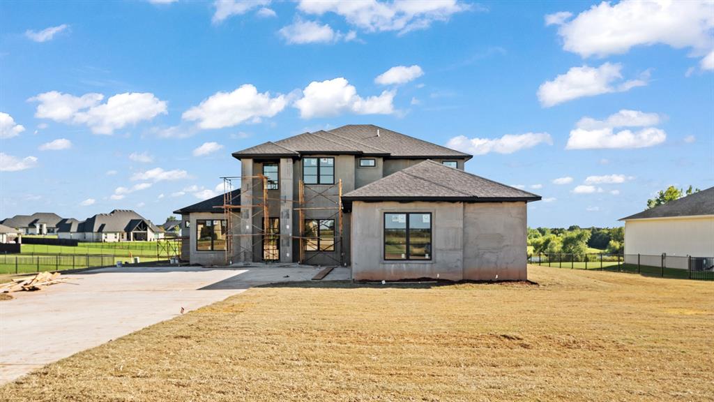 Just in time to MAKE IT YOUR OWN! This beautiful stucco modern home sits on a premium lot with water views and boasts a well-thought-out floor plan with floor-to-ceiling windows, and abundant natural light.

Step inside the impressive living room with its soaring two-story ceiling, brilliant clerestory windows, and expansive slider doors that open to a spacious patio with an outdoor fireplace — the perfect spot to enjoy the serene waterfront setting.

The luxury kitchen is a true showpiece, featuring a fully finished bar, scullery, and plenty of countertop space. You’ll also find waterfall quartz countertops and a commercial-style refrigerator/freezer that elevate both style and function.

Located in the highly sought-after Addington Farms community, this home offers everything you desire, luxury finishes, thoughtful design, and endless possibilities, all within award-winning Deer Creek Schools.

Don’t miss out on this rare opportunity. Schedule your showing today and make it yours!