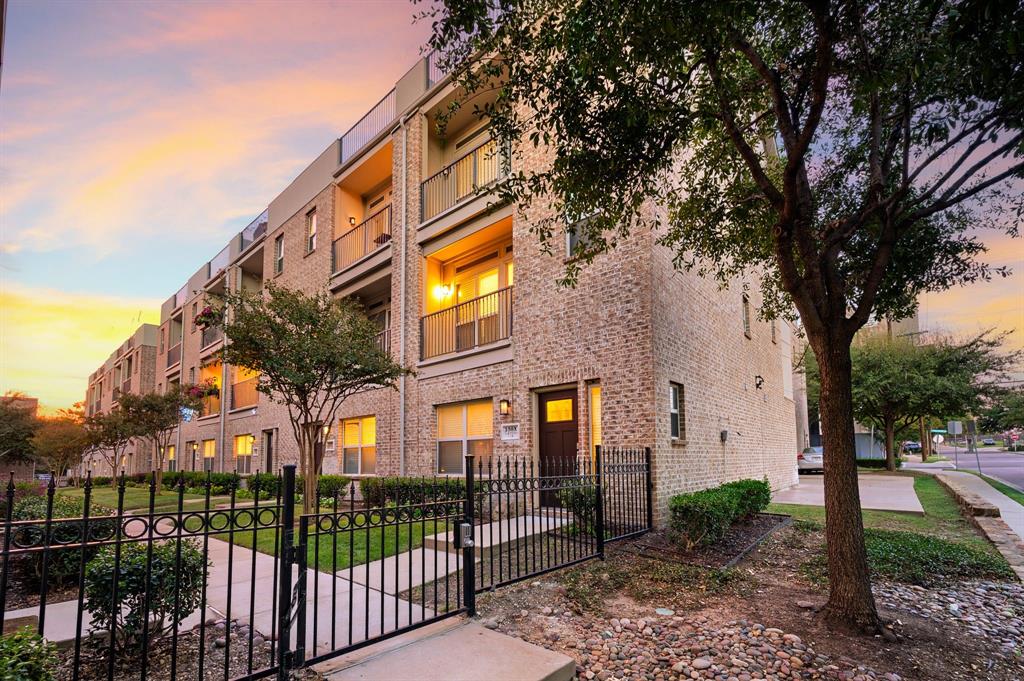 Welcome to this beautiful end-unit townhome in the desirable Old East Dallas! Just steps away, Exall Park and Recreation Center offers green space and fitness amenities, while the Bryan Place Swimming Pool Association is approximately a 10-minute walk away. Enjoy convenient access to Baylor University Medical Center, Downtown Dallas, Uptown, and West Village, along with an abundance of nearby shopping, dining, entertainment, and recreation. Featuring 2 bedrooms, 2.5 bathrooms, two living areas, soaring ceilings, and no carpet, this thoughtfully designed home blends modern style with exceptional functionality. Hardwood flooring extends throughout the main living areas, complemented by newer luxury vinyl plank flooring in both bedrooms and ceramic tile in all bathrooms and the utility closet. The first floor features a private bedroom with an ensuite full bath, a utility closet with washer and dryer connections, and an attached private two-car garage. The second floor showcases an open-concept living, dining, and kitchen area, perfect for everyday living and entertaining. The gourmet kitchen boasts stainless steel appliances, granite countertops, a designer backsplash, a large island, and a spacious walk-in pantry. A convenient half bath completes this level. The third floor offers a versatile second living area or bonus room adjacent to the primary suite, ideal for a home office, media room, or flex space. The spacious primary bedroom features an oversized walk-in closet with built-in shelving and an ensuite bath with dual vanities. Head to the rooftop deck to enjoy a partial view of the Dallas skyline, perfect for relaxing or entertaining. Community amenities include a gated outdoor gathering area with barbecue grills beneath a pergola, a firepit, and designated pet areas. Experience the best of urban living with modern comforts, versatile spaces, and an exceptional location!