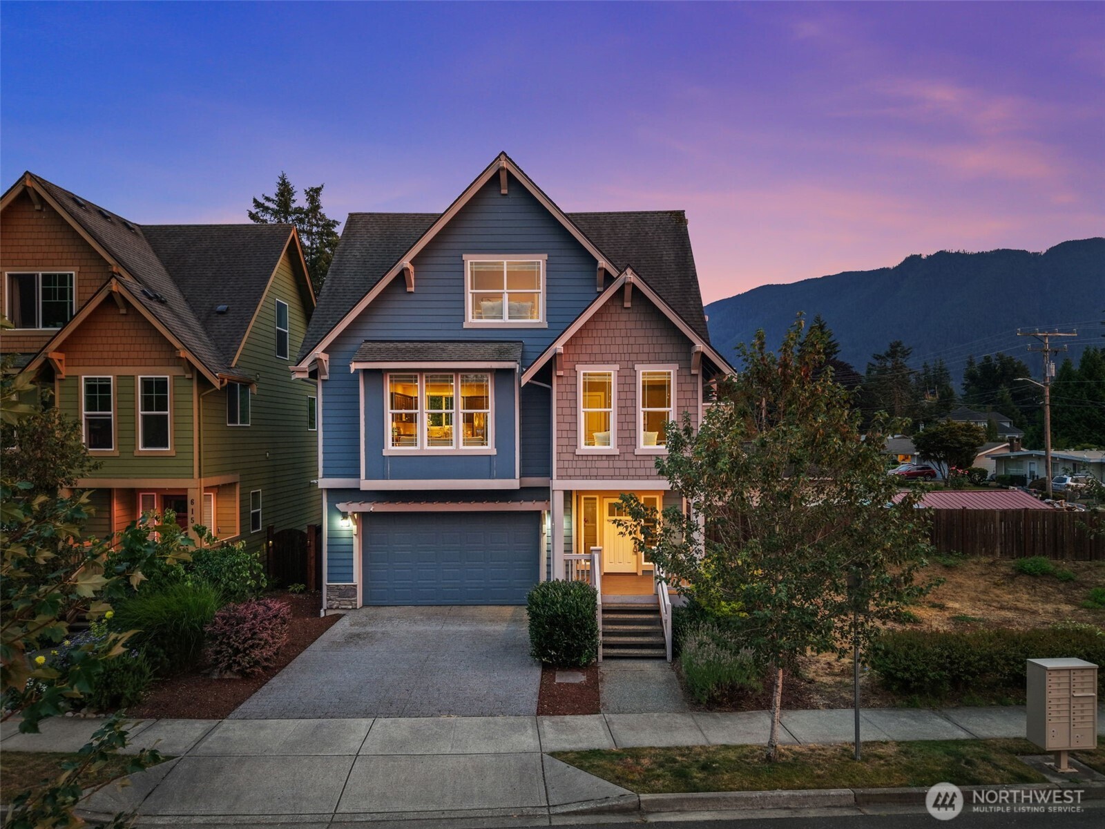 Welcome to modern North Bend living, where comfort, style, and an incredible location come together! This beautifully designed 4 bed, 3 bath home offers 1,860 SF of bright, open living space with a versatile floor plan perfect for everyday living and entertaining. At the heart of the home is a spacious chef’s kitchen featuring a large island w/seating, quartz countertops, SS appliances, pantry, and engineered hardwood floors. The kitchen flows into the dining area and light-filled living room, where large windows provide abundant natural light and a cozy gas fireplace creates the perfect place to relax. The main level offers flexibility with 2 bedrooms and a 3/4 bath featuring dual shower heads and tile floors—ideal for guests or a home office. Upstairs, retreat to the spacious owner’s suite w/a large walk-in closet and en-suite bath featuring an oversized walk-in shower, double sink quartz vanity, and tile floors. The 4th bedroom feels like a second suite with its own walk-in closet and en-suite bath. Additional features include new carpet, AC, tankless water heater, generator hookup, dedicated laundry room, and a 2-car garage with epoxy floors. Step outside to a fully fenced backyard with plenty of space for entertaining! Enjoy low HOA dues of $55/month & an exceptional location mins from Downtown North Bend, shopping, dining, Torguson Park, E.J. Roberts Park, hiking, trails & endless outdoor recreation. Easy access to I-90. Beautifully maintained and thoughtfully designed.