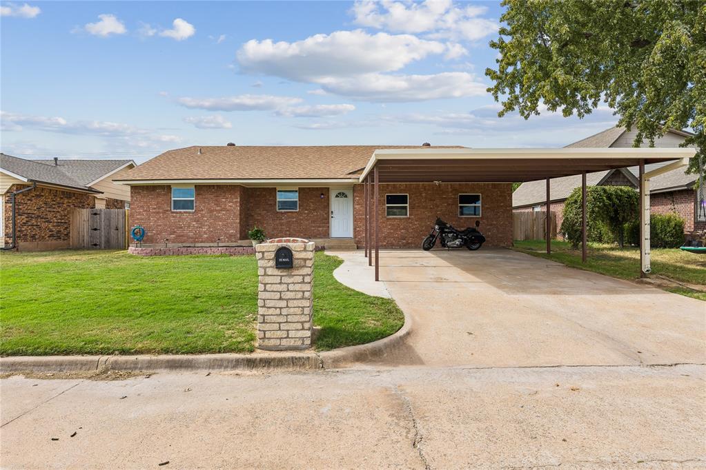 This extensively updated home offers a long list of improvements, modern conveniences, and added features that make it a must-see. The former garage has been fully converted into two additional bedrooms, creating flexible living space to fit your needs.Step inside to discover a completely updated kitchen featuring all-new cabinetry, a built-in gas cooktop with convenient pot-and-pan drawers, an electric double wall oven, and two floor-to-ceiling pantry cabinets. The open-concept design creates a welcoming flow for everyday living and entertaining. The dishwasher and garbage disposal were replaced in 2023. The refrigerator, built-in washer and dryer, 72-inch TV, electric fireplace, and Ring doorbell and security system with accompanying equipment are all included.Flooring has been updated throughout, with carpet in the living room and primary bedroom and tile in the four bedrooms and remaining rooms, hallways, and entryway. Interior improvements include new lighting and fixtures throughout, a new front and back door, updated trim and woodwork, and electrical upgrades with new outlets and light switches.The exterior has received extensive improvements, including new OSB sheathing and a vapor barrier to help improve the home's air tightness, along with new construction-style, low-E, double-pane windows filled with argon gas. New brick surrounds the home, complemented by a matching brick mailbox. The HVAC system was replaced in 2018, and the roof was replaced in 2017.Outdoor features include a permitted front carport added in 2023, a back porch added in 2024, and new fencing along both sides of the property within the last two years. The backyard also offers a below-ground storm shelter and a 10x10 storage shed with a concrete floor. The rear metal fence belongs to the neighboring insulation company, which maintains it.