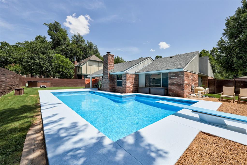 **Stylishly Updated & Poolside Ready!** This beautifully remodeled home offers thoughtful upgrades throughout, featuring three fully renovated bathrooms, each showcasing modern fixtures and large-format tile for a clean, contemporary look. The kitchen also boasts the same elegant tile flooring, blending style with durability.
Enjoy cooking with a new stove and dishwasher, complemented by recently upgraded windows with privacy tinting and wood-look LVP flooring that flows seamlessly through the living spaces. The bonus room is currently being utilized as a fourth bedroom, second living room and gym offering a flexible space to suit anyone's needs.

Step outside and escape to your private backyard oasis with a renovated 35,000-gallon pool—10 feet deep and finished with sparkling glass mosaic tile. The entire pool pad features new equipment, ensuring low maintenance and high enjoyment all year long. Additionally you can unwind after a long day in the 6-person Caldera hot tub, the perfect complement to the expansive outdoor living space. A recently replaced roof adds to the peace of mind of this thoughtfully upgraded home. 

This home blends modern updates with outdoor luxury—don’t miss your chance to own a true entertainer’s dream!