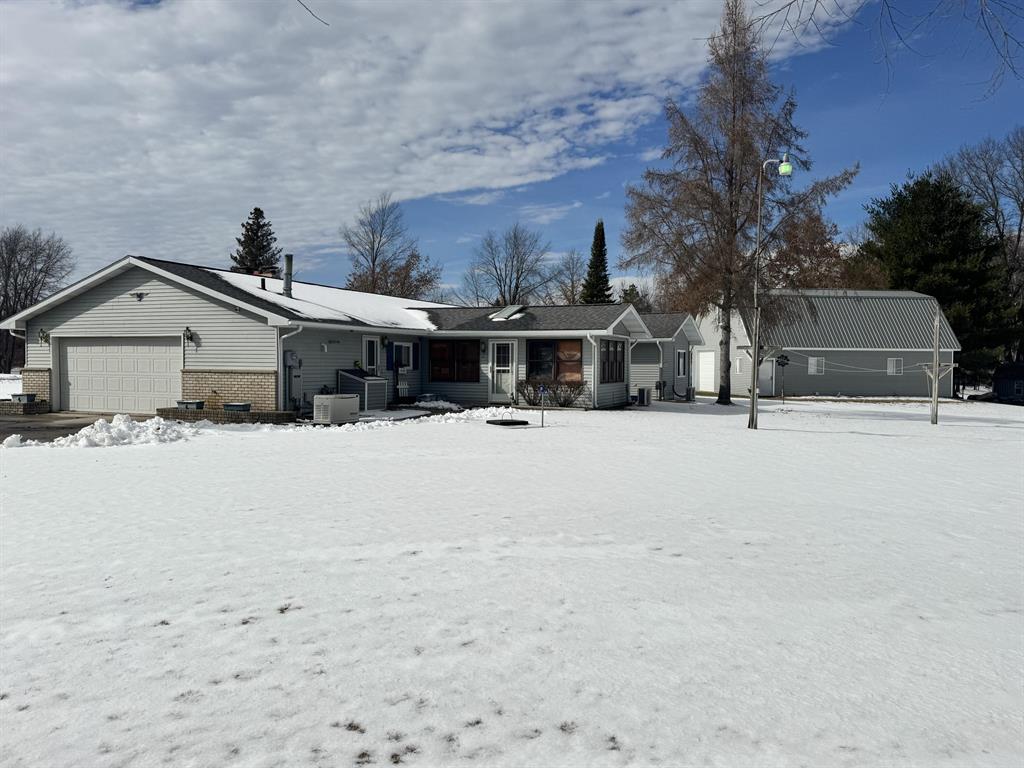 Well-maintained 3-bedroom, 2 full bath ranch built in 1981 and lovingly owned by the same owner since 1997. Situated on desirable waterfront on Tom and Dock Lake, this property features a newer seawall and covered boat slip/cut-in--perfect for enjoying lake life. The home offers a spacious layout with a large kitchen and island, ideal for entertaining, along with an attached 2-car garage and updated electrical.Outdoor features include a large two-story pole barn with lift and office, plus two additional sheds providing ample storage and workspace. Located on a quiet dead-end street, this property offers privacy, functionality, and direct water access all in one.