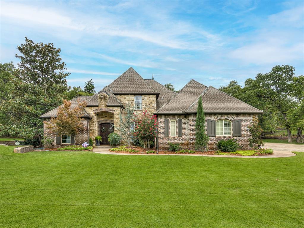 *Home just appraised for $1,030,000* Totally remodeled entertainer’s home in a prime Edmond cul-de-sac location on 1.2 acres, just minutes from I-35, shopping, and schools. This home has been thoughtfully updated inside, blending luxury finishes with a highly functional floor plan. The layout offers the best of both worlds with open living and kitchen areas for gatherings, plus separation when desired. Two dining spaces, two living rooms, a downstairs guest suite, 2 large upstairs bedrooms, and a game/media room provide flexibility for every lifestyle. The first floor features luxury vinyl plank flooring, while new carpet was added upstairs and on the staircase. Fresh paint, new stair railing, and designer fixtures throughout, including a Restoration Hardware chandelier in the living room, elevate every space. The chef’s kitchen was completely reimagined with custom soft-close cabinetry with pull-out shelving, marble countertops and backsplash, farmhouse sink, pot filler, 48” JennAir gas range with electric oven, and high-end appliances. The office and powder bath were fully gutted and rebuilt, while the guest bath, upstairs bath, and media room with new projector all received stylish updates. The primary bath shines with quartz countertops, marble shower tile, new lighting, mirrors, and plumbing fixtures.
Exterior improvements include a full repaint in 2025, new insulated faux wood garage doors in 2024, garage repaint and lighting in 2025, and freshly stained front doors. A tornado shelter (2025) fits 6–8 people, and the aerobic system has been carefully maintained with major updates and a new electric line. The backyard is a private oasis with mature trees, new landscaping, a sparkling pool with new filter, outdoor fireplace, and park-like setting. New trees were planted in 2024 and 2025, the grass has been reseeded. A new water softener was added in 2022.  Truly a turnkey home in one of Edmond’s most desirable settings.