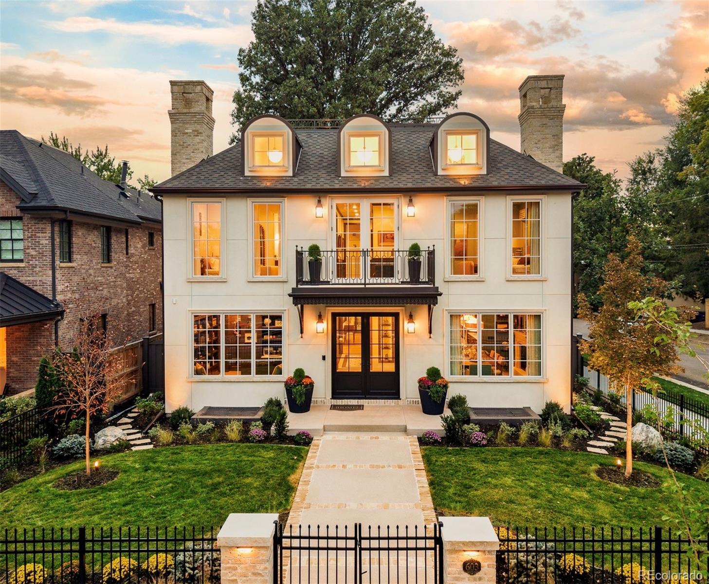 603 S Downing Street is where French provincial architecture, unparalleled luxury, extraordinary artistry, & American nostalgia collide. This 2026 Denver Life Magazine Designer Showhouse is one of the largest, most elevated, & most prestigious properties Wash Park has ever seen. This parkside new construction masterpiece on a prime corner lot overlooking Smith Lake is a collaboration between Definition Homes, (Denver premium luxury builder), Denver Life Magazine, Denver's top interior designers, & premium luxury brands. With over 6700 total square feet, this home offers 6 beds/7 baths (including the ADU), 4 levels of grandeur, a private courtyard, expansive rooftop deck overlooking the park, 4 premium fireplaces, custom designer details in every space, & a private luxurious ADU/guest quarters. Built with century-old historical repurposed brick to implement the highest quality materials & to connect to Denver’s architectural past. Designer kitchen w/custom rift cut white oak cabinetry, 43" workstation sink, Wolf/Subzero appliance package incl dual refrigerators, dual dishwashers, built-in coffee system, quartzite countertops & more. Private library w/ custom hidden murphy bookshelf door which connects to the main floor home office. Primary bedroom w/10 ft ceilings & ensuite bath w/heated tile floors, Kallista freestanding tub, & Calacatta marble steam shower. Add'l garden terrace exterior rooftop patio. Full basement w/10'3" tall ceilings, designer bar, & entertainment area w/lighted built-ins & 98" TV w/Savant home automation & Paradigm audio system. Home gym w/custom mural & lighted Robern mirrors. $30K+ exterior/landscape lighting system. This home has an extremely extensive list of features/specs. Contact listing agent Ryan Borger at 303-929-8722 or ryan@podiumproperties.com for full specs list & property details. Showings by appointment only w/listing agent present. Buyer to verify taxes (not yet assessed). Buyer to verify sq footage. Sq footage includes ADU.