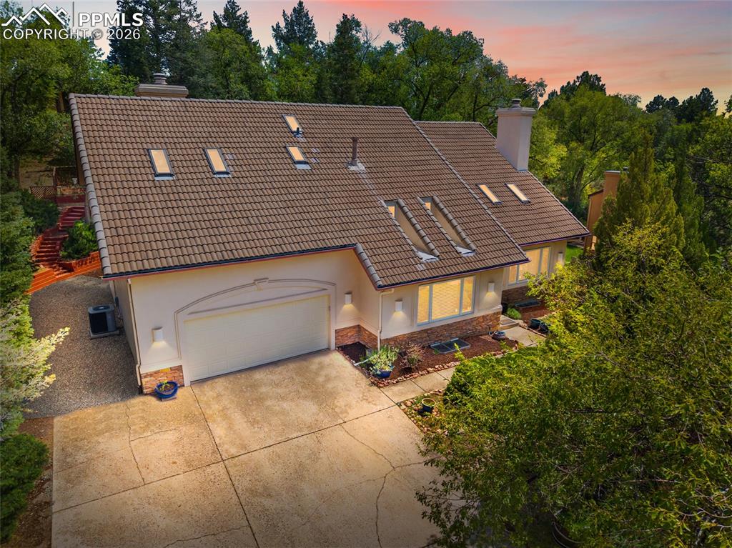 Unique and Private Westside Oasis in the heart of the city. This ample, well-cared for home offers amazing livability, plenty of space to enjoy, nature views out of almost every window, and an amazing neighborhood with access to so much Colorado Springs has to offer. Numerous updates throughout this 4 bed, 3.5 bath, over 4000 square feet home! Multiple living spaces across all 3 levels. These could be used for library space, office space, entertaining, or media. Main level entry impresses with soaring ceilings and tons of natural light through the showpiece east facing window. The kitchen is open to main level living (complete with wood burning fireplace) and dining room, as well as in earshot to the loft directly above. The master bedroom is a true peaceful retreat with vaulted ceiling, skylights, cedar closet, a fireplace, private balcony patio overlooking the terraced backyard with privacy. The basement provides great guest or hobby space, with 2 bedrooms, a 3/4 bath, a cozy family room and a bonus space that could be used as a small theater room or hobby studio. Additional storage space in the basement complete with a second cedar closet. 2 car garage, attached storage shed, terraced and beautifully landscaped back yard, and generous stamped and stained patio with pergola. Amazing! All this usable space, and the location couldn't be better. Less than 1 minute to I25, and but a few minutes from downtown, Garden of the Gods, Old Colorado City and other westside attractions. High Point Gardens is such a quaint and unique westside neighborhood, with many homes designed by local architectural legend Elizabeth Wright Ingram. Direct access to Sonderman Park Open Space from a neighborhood trail (4 lots away), and very little traffic through this hidden gem westside neighborhood.