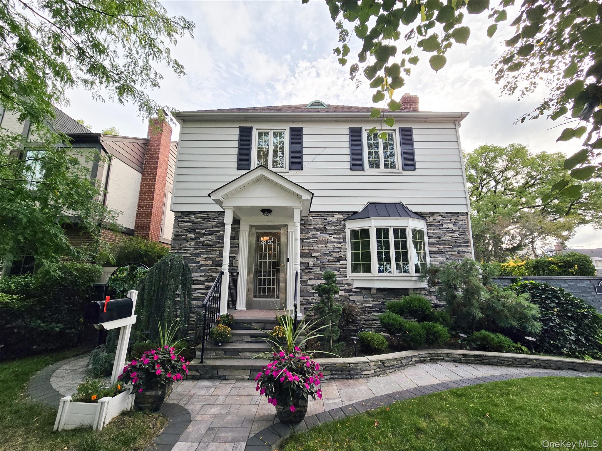 Welcome to this spacious and inviting home in a quiet and desirable neighborhood, with highly regarded elementary and middle schools within walking distance. Enjoy easy access to major highways, a 5-minute drive to the LIRR station, and nearby shopping, dining, and parks.Located on a beautiful tree-lined street with wide roads, this home features bright and spacious living areas with a combination of hardwood and marble flooring. An updated ductless mini-split system provides efficient heating and cooling with individual room temperature controls. The attic has also been upgraded with insulation and air sealing for improved energy efficiency and year-round comfort.The home also features a well-appointed kitchen, flexible living space, a finished lower level, and a private patio and outdoor area—perfect for relaxing or entertaining.A wonderful combination of space, comfort, convenience, and peaceful living in a great location.