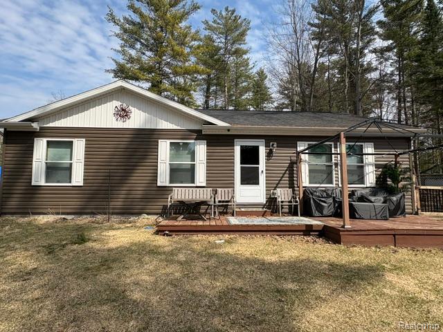 Welcome to Secord Lake!  Enjoy the property year round in this 1344 square foot modular home built in 2018. This well maintained, move in ready home sits on nearly an acre of property with 175 feet of water frontage. Home boasts 2 bedrooms, guest bathroom, 3rd bedroom is the large primary with walk in closet and primary bath with tons of storage. The spacious living room is an open concept to a large eat-in kitchen, including refrigerator, stove, microwave, dishwasher, disposal, all included. Separate laundry room with washer and dryer, included. The house sits on a four foot crawl space under entire home which is insulated and has duct work so remains heated and cooled. Crawl space also houses a bladder tank for the well, sediment filter, sulfur smell water filter and water softener. Outside you will find a 12x25 foot shed with 240 volt electrical service and brand new roof, 10x25 metal shed for even more storage and an oversized 2.5 car garage with pole barn like structure. The front porch has a gazebo structure with screening so you can still sit out even if it's raining. There is also a huge deck overlooking the water with a gazebo structure on it and newly painted with steps leading down to an additional deck right on the water with a new foundation in 2025. Well and septic-2015. Septic cleaned out-2025. Newer cement pad behind the house for parking, as well as a long gravel driveway leading to house from the road. A gas line runs from the road to the house, as well as internet and cable. There is also underground electrical running from the first pole (between shed and garage). Available are 2 camper hook-ups with a camper dump in the driveway and an outside faucet filtered for camper use. Partially fenced yard with a 3 foot fence and a large dog pen off to the side. Also a sandy beach on the water to enjoy. Be in before summer and enjoy!!! Seller is licensed real estate agent.