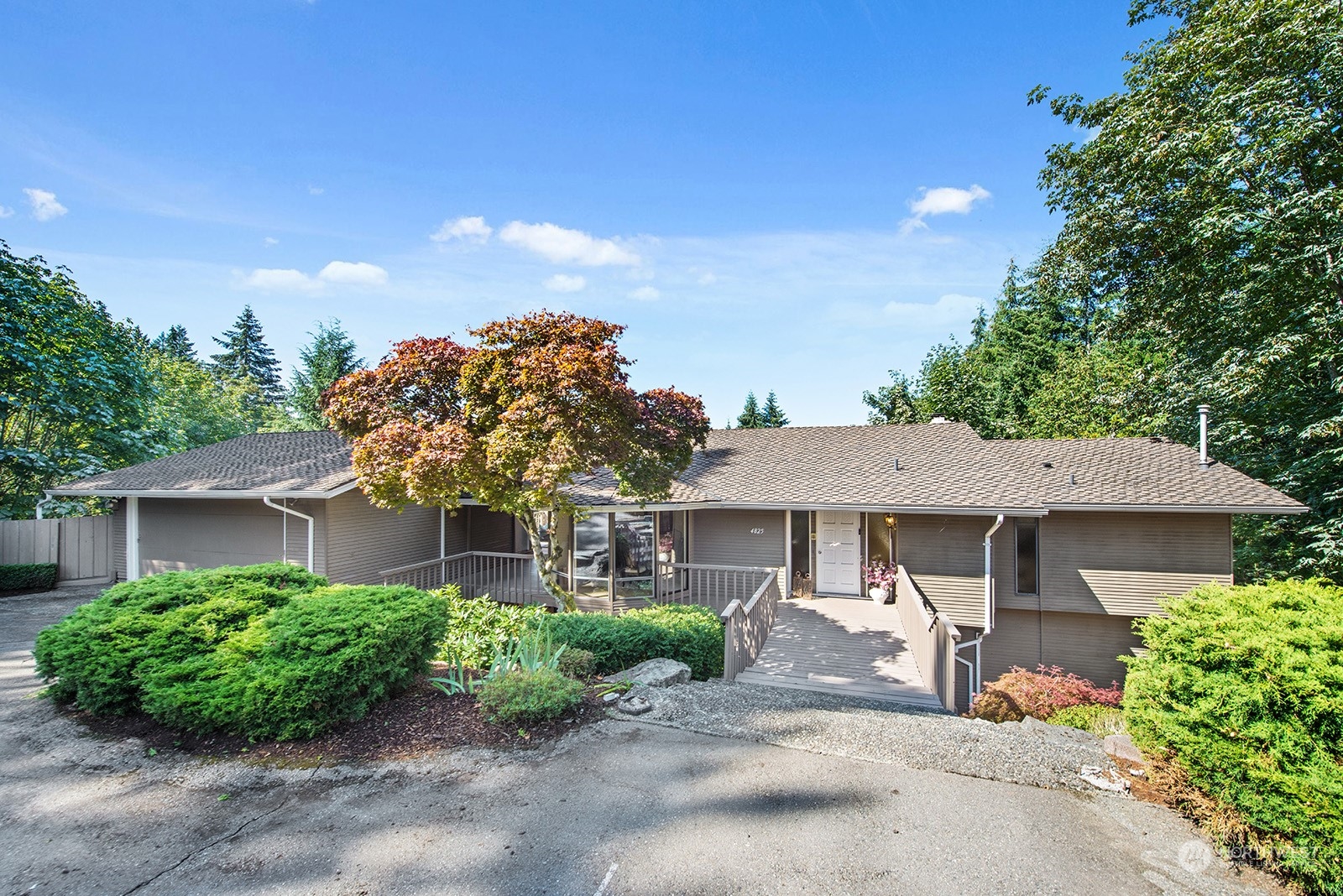 Welcome home -centrally located mid-island, right were you want to be! An updated 4 bedroom, 4 bathroom, 4,180sf updated & well cared for residence. Boasting fantastic west facing filtered lake views & huge entertainment sized view deck- perfect for play and entertaining. A great layout with Primary Suite on main level and formal dining, living  and family rooms. Lower level has fantastic spaces for play, office and media room. Home features include: Air Conditioning, Gas Cooktop, two kitchen sinks & wine fridge. Easy access to schools, shopping, parks, dining and freeway.