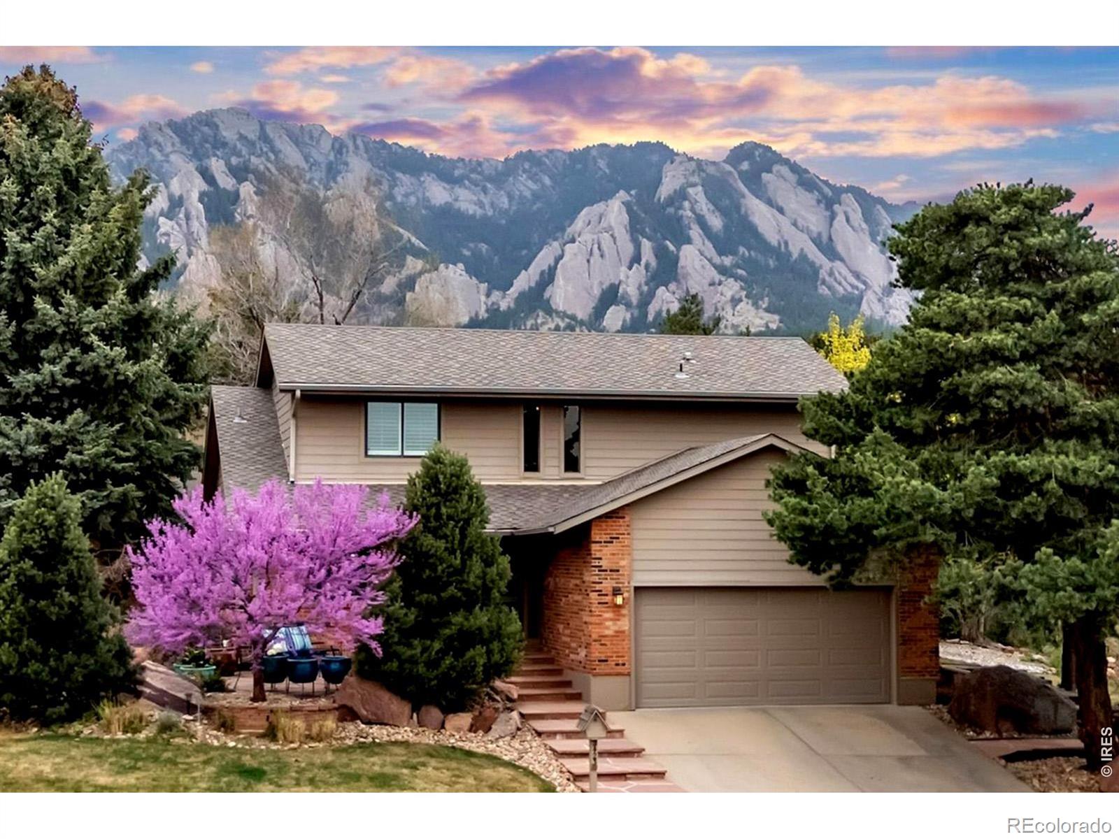 Exceptional opportunity in the highly sought after Devil's Thumb neighborhood of South Boulder. Tucked away on a quiet cul-de-sac, this tastefully remodeled and meticulously maintained two story home, designed and built by renowned local builder Lee Corzine, is offered by its original owner and reflects true pride of ownership. The exterior features a timeless blend of James Hardie siding and brick, complemented by Marvin Infinity windows throughout. A professionally designed front patio and landscape by LID Landscaping and Marpa Landscape Design creates a warm and inviting approach, offering a peaceful setting to relax, enjoy mountain views, and connect with neighbors, capturing the true spirit of the neighborhood. The thoughtfully designed floor plan features a main floor primary suite with vaulted ceilings, walk-in closet, and refined 3/4 bath with heated tile floors. The eat-in kitchen includes quartz countertops, black shaker cabinetry, built-in coffee bar, pantry, and stainless steel appliances including a gas range. The open living and dining areas are anchored by vaulted ceilings, a gas fireplace, and built-ins, with sliding doors opening to a private brick paver patio, ideal for grilling or morning coffee. Upstairs, two well proportioned bedrooms with walk-in closets share a full bath, offering comfortable separation from the main floor primary suite. The finished basement provides a cozy family room with two built-in office or study alcoves, a well designed laundry room, plus a bedroom, and a 3/4 bath, creating a flexible and inviting guest space. Additional features include Karastan wool carpet and plantation shutters on the main and upper levels, along with a well equipped garage featuring built-in cabinetry and a newly finished floor with a durable Pentec coating. Ideally located close to trails, parks, and Colorado's highest rated schools, this is a rare opportunity to own a truly special home in one of South Boulder's most desirable neighborhoods.
