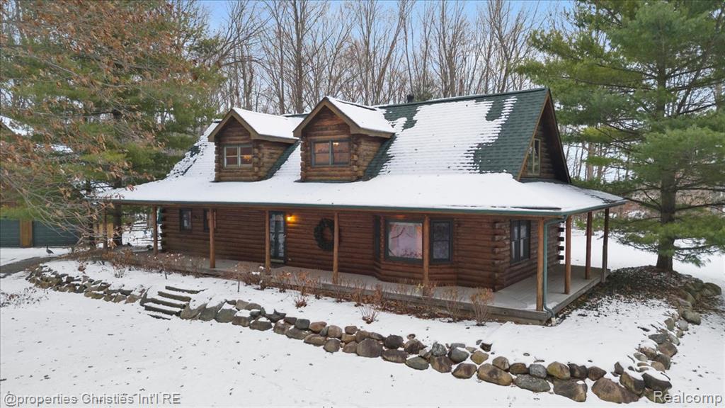 **OPEN HOUSE SATURDAY DEC. 6TH 10AM - 12PM.** This custom-built cedar log home sits on 7.27 acres in St. Clair Township on a private road just minutes from Downtown St. Clair. The drive continues back until the land opens into a cul-de-sac surrounded by trees, with this impressive log home tucked off the road. The exterior offers stick-built construction with a cedar log finish and a wrap-around porch.Inside, the great room features a 22 ft. natural stone fireplace, bay window, French doors, and Hurd double-paned tinted windows. The home includes 3 bedrooms, 2.5 baths, geothermal heating and cooling, a whole-house humidifier and dehumidifier, a Generac generator, central vacuum, and cellulose insulation.Recent updates include new roofs on both the home and the pole barn (2024) and a new rear trex deck (2024). Additional features are rock landscaping, leaf guards on the gutters, three new garage doors on the pole barn, a 102 ft. well,sump pump, and a sprinkler system that draws from the pond.There is also an optional 5.59-acre wooded lot available next door for buyers looking for additional acreage and flexibility. This property offers a unique setting, solid construction, and a long list of updates, making it a standout opportunity in St. Clair Township.