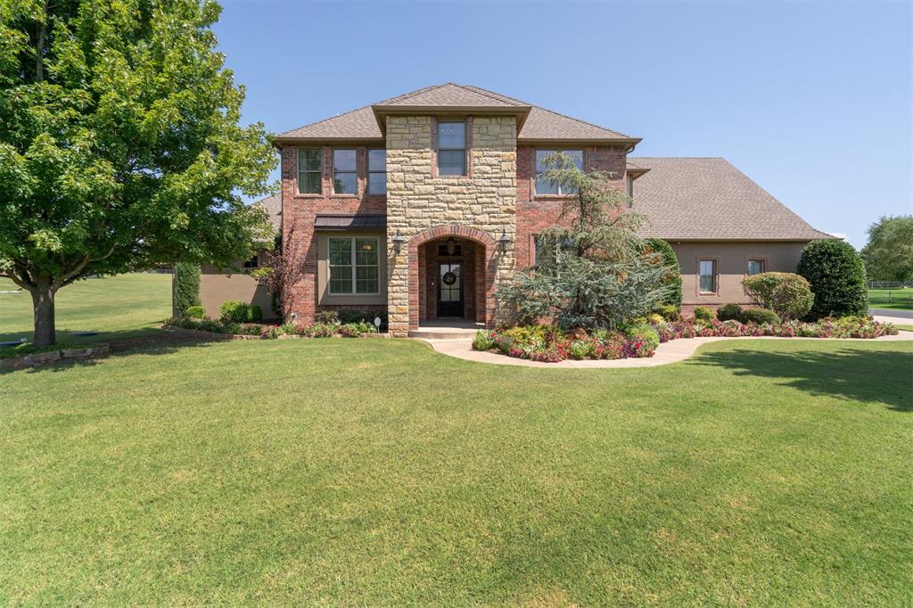 Look no further to find your family's perfect oasis located in Edmond's highly coveted Stone Valley Ranch neighborhood. This home, on a corner lot that is perched on just over 1 acre, boasts a luxurious saltwater pool/spa complete with outdoor kitchen and gas fire pit. Inside, you will find gorgeous wood floors and stacked stone fireplace, an open floor plan with vaulted ceilings, and double glazed windows that provide tons of natural light. The primary bed and secondary ensuite are both located downstairs. Upstairs, you will find two large bedrooms with generous closets and a shared, designated study space. Travertine floors have been added providing additional warmth throughout the kitchen and dining area as well as the foyer. The kitchen with large island and bar seating is full of opportunity for family gatherings amidst the beautiful cabinetry and stainless steel appliances. Also, recently added, is the fully air-conditioned/heated workshop (2 car garage) with an upstairs flex space that could serve as an amazing "man cave." A pool/half bath is conveniently located there as well. Each driver in the family can pick their spot in this home's 5 car garage. Schedule your showing today!