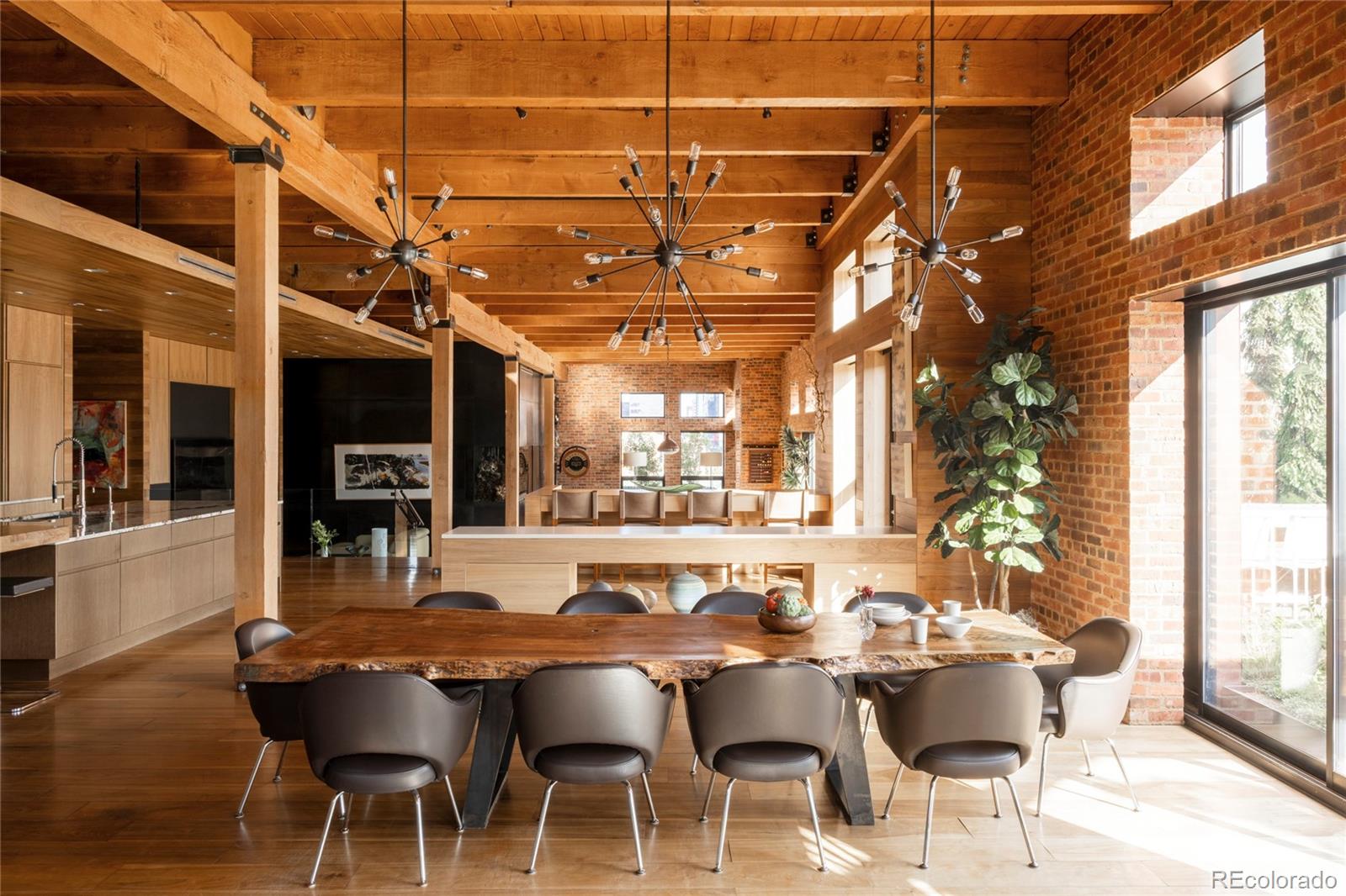 There’s a distinct feeling that comes with a true loft-style home—authentic, sophisticated, urban, and refined. It’s not a condo; it’s something far more special. It’s a home perched atop a historic building in the coolest part of the city. You’ve likely seen this in places like this in Chicago, New York, or Boston—where living in the city is part of your identity. In Denver, this type of property is truly one-of-a-kind.  The Penthouse at the Saddlery Building is unlike anything else in town. Dating back to 1900, the Saddlery Building is rooted in Denver’s industrial past, when LoDo was a hub of economic growth. Today, this incredible home crowns the building as its only residential unit. Originally designed as two separate penthouses, the current owners purchased both and worked with Boss Architects to craft one remarkable home.  Spanning over 6,700 square feet, the penthouse offers unmatched privacy and sophistication. Designed for both family living and entertaining, the space is described by its architects as “an oasis”—a feeling that becomes instantly clear upon entry.  Expansive open areas, soaring ceilings, and abundant natural light are complemented by thick brick walls and heavy wood timbers, providing historic character and surprising tranquility. Distinct living, dining, and entertaining spaces support both intimate gatherings and larger events. Private quarters include three ensuite bedrooms, an art gallery, wine room, office, and a craft room that can double as a fourth bedroom. There’s even a “garage” designed for creative pursuits. The penthouse exterior is wrapped in copper, adding a timeless feel.  Outside, the 2,500 sq ft rooftop terrace seamlessly connects indoor and outdoor living with disappearing glass walls, lush landscaping, water features, fire pits, and a full outdoor kitchen—delivering luxury, comfort, and ultimate privacy.  This is a must-see property.  There is only one of these in Denver and if you miss it, it will be gone.