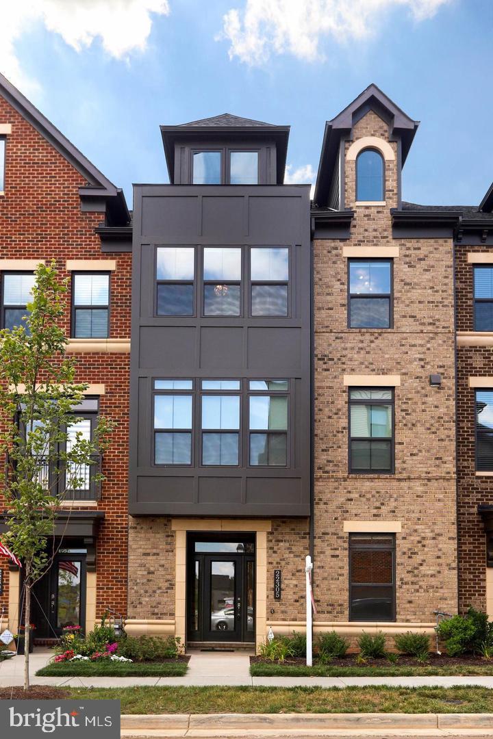 Nestled in the desirable community of Westmoore at Moorefield, this exquisite townhouse offers a blend of luxury and comfort, perfect for those seeking an elevated lifestyle. Built in 2018, this meticulously maintained residence spans an impressive 3,467 square feet, showcasing a thoughtful design that emphasizes both elegance and functionality. Step inside to discover an inviting open floor plan adorned with rich wood flooring on all 4 levels and enhanced by recessed lighting, creating a warm ambiance throughout. The gourmet kitchen is a culinary enthusiast's dream, featuring upgraded countertops, a spacious island, and high-end stainless-steel appliances, including a built-in microwave, wall oven, and cooktop. The adjoining family room, perfect for entertaining, flows seamlessly into the dining area, making gatherings effortless and enjoyable. Retreat to the luxurious primary suite, complete with a walk-in closet and a spa-like en-suite bathroom that promises relaxation and rejuvenation. Thoughtful touches such as ceiling fans and elegant window treatments enhance the overall comfort of the home. The exterior of the property is equally impressive, featuring charming bump-outs and multiple balconies that invite you to enjoy the fresh air. A private roof deck offers a serene escape, perfect for unwinding after a long day. The community amenities are second to none, including a sparkling outdoor pool, a well-equipped exercise room, and beautifully maintained common grounds, all designed to foster a sense of community and leisure. Parking is a breeze with an attached two-car garage and additional driveway space, ensuring convenience for you and your guests. The property is also equipped with modern security features, providing peace of mind. With easy access to public transportation, including a metro station less than a mile away, and proximity to local amenities, this home offers the perfect balance of tranquility and accessibility. Experience the lifestyle you've always dreamed of in this stunning residence, where luxury meets comfort in every detail. (Professional photos will be downloaded on sept 1)