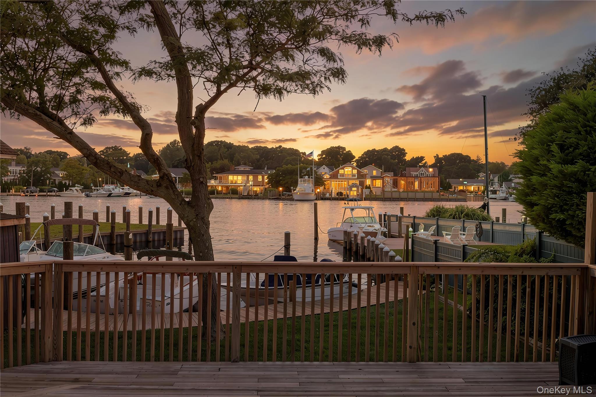 Waterfront Perfection in Islip:  Breathtaking views, Luxury Upgrades, and No Mandatory Flood insurance!  Welcome to your boater’s Paradise in Islip’s highly coveted Snug Harbor neighborhood. Situated on an exceptionally wide section of the Orowoc Creek just off the Great South Bay, this completely modernized 3 bedroom Cape Cod offers the ultimate coastal lifestyle.  Enjoy unobstructed Southwest-facing sunset views right from your property.  Boaters will love the private dock featuring 2 dedicated boat slips, offering effortless minutes-away access to Fire Island and the Fire Island Inlet leading to amazing beaches and fishing grounds. Step inside to a showroom-quality, freshly painted interior.  The seamless open-concept main level features stunning 4-inch quarter-sawn oak flooring and cozy radiant heat.  The chef’s gourmet kitchen is a masterpiece, complete with a massive L-shaped Island, Premium Sub-Zero refrigerator, and a professional-grade Wolf range. For ultimate convenience, the first floor includes a spacious laundry room, a custom tiled bathroom and an en-suite bedroom.  Upstairs you will find two additional large bedrooms and a second custom tiled bath with a 2nd zone of hot water radiant heated flooring. Enjoy your morning coffee on the deck off the primary bedroom with the same exceptional water view. The entire home is powered by a super efficient,4 zone Navien tankless gas system.  The Exterior boasts incredible curb appeal featuring brand new Hardie Board siding, new energy efficient windows. a newer roof, a newly paved driveway, paver walkways, and a classic bluestone front stoop.  Location is everything—live just blocks away from the local elementary school, vibrant main street, town beach, and the town boat ramp. Do not miss this rare opportunity to own your piece of waterfront paradise.