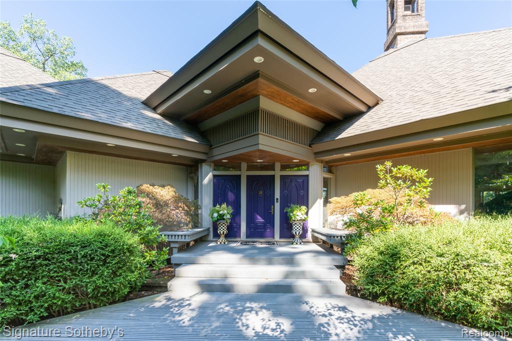 VERY MOTIVATED SELLER! Custom built 4000 sf home with 230' of sandy beach frontage on Cavanaugh Lake with 7.48 acres  at the end of a private drive! Super solid contemporary Warren Porath built home with the Huggins Design allows for maximum lake views & sunsets through the entire house. This home is an entertainers delight. Main floor has an open flow anchored by a 2 way slate FP in the open Great Room surrounded by the dining & extra flex space all with floor to ceiling Andersen windows which maximizes the water views and light. Open kitchen with bountiful cabinets and counter space that again gives you amazing views of the water. Breakfast nook overlooks the water so what a way to start your morning. Every room boasts a double tray ceiling with fan, custom detailed doors, new marble in main living space. Wood detail ceilings & bountiful built in surround both sides of this amazing fireplace. Primary suite features a magnificent view with a large walk in closet with built ins, a separate office/sitting space that leads to one of several decks overlooking the water. Two additional bedroom suites with great views offer private full baths, Currently private office is used as (4th bedroom) has closet furniture to have it a functional bedroom. A sun room off the kitchen that leads to a large deck that finishes this incredible first floor space. Updates include: New roof in 2021, Beautiful 2,000 sq. ft. Cedar deck, professional landscape lighting, newer fencing, newer private gate perfect for privacy. Basement is over 3,000 sq. ft. and is ready to be finished. Second storage area to the back of the house is excellent to store those boating toys and small vehicles. House has a Geo-thermal heating system which is state of the art. 7 foot fountain installed in 2022. Full house generator system.  Multiple docks, sprinklers and so much more. This is a one in a lifetime masterpiece awaiting your finishing touches. Call us today for a private showing.