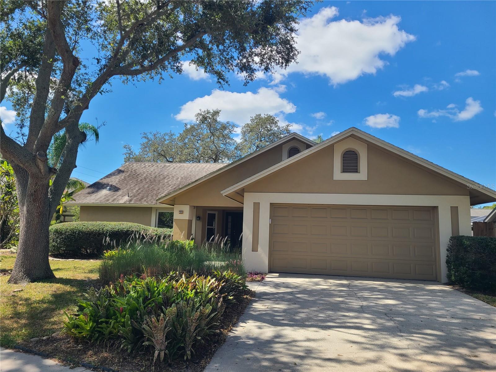 Fantastic Opportunity to own this Palm Harbor Pool Home situated on a peaceful Cul De Sac in the serene community of Wexford Leas - Entering this 3 Bedroom / 2 Bath Pool home you will be greeted with Cathedral Ceilings and a open Floor Plan leading to your Backyard Oasis - Tile and Laminate floors through out, with NO carpet - Interior Walls and Ceilings have been freshly painted and Newer Over sized Baseboards are a plus -  Open Kitchen with a breakfast bar lend itself to accommodate entertaining - Spacious Primary Bedroom boasts updated Bath and walk in closet - Laundry Room with utility sink and built in storage - Newer Carrier AC (2022) - Double Pained and Hurricane rated windows - large Screened Lanai flows into the outside Retreat featuring large privacy Fenced (2024) yard with a sparkling in ground Pool recently converted to Saltwater - Highly sought after Ozona Elementry  and Palm Harbor Middle and High School zoning - No Flood Insurance Required - Short drive to Honeymoon Island, Quaint downtown Palm Harbor, Pinellas Trail and Trendy Downtown Dunedin offering, Cafes, Restaurants, Boutique Shops, the Highland Park Fine Arts Center and much more