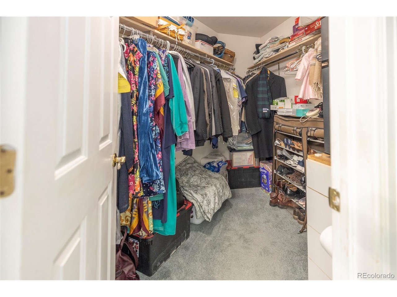 Enjoy easy living in this ground-level condo featuring a spacious primary suite with a walk-in closet and private bath. The cozy living room centers around a warm fireplace, while the kitchen offers stainless steel appliances and functional space for everyday living. Durable vinyl tile flooring throughout makes maintenance simple, and the in-unit washer/dryer combo adds extra convenience. Complete with a 1-car detached garage, an additional reserved parking space, and access to the community outdoor pool and clubhouse, this home offers both comfort and practicality in a great setting.