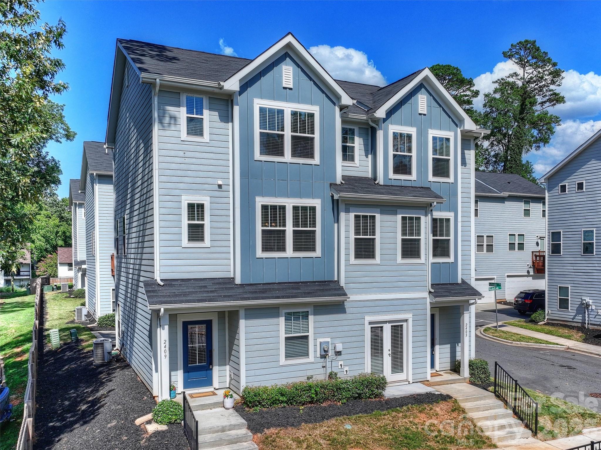 This move-in-ready 2-bed, 2.5-bath townhome offers stylish, low-maintenance living in one of Charlotte’s most sought-after and rapidly growing areas. Tucked between Country Club Heights and Windsor Park with quick access to Uptown, Plaza Midwood, and NoDa, you’re surrounded by some of the city’s best restaurants, coffee shops, live music, and local favorites just minutes from your door. Prefer the outdoors? Nearby Kilborne Park and Evergreen Nature Preserve offer walking trails, green space, and disc golf for an easy escape from the city buzz.Part of the intimate Vela Grove enclave, this thoughtfully refreshed townhome pairs sleek, modern finishes with functional space in a location that stands out—especially at this price point. In an area where finding a home under $400K with this level of finish, square footage, and garage parking is increasingly rare, this townhome offers exceptional value without compromise. The open-concept layout is ideal for entertaining, working from home, or simply relaxing in style. Need extra flexibility? The lower-level bonus space makes the perfect home office, gym, or creative studio. Plus, the 2-car tandem garage provides the convenience of private parking and extra storage—another hard-to-find feature in this location.Leave the car in the garage and enjoy city living with room to breathe. Ask about available financing incentives!