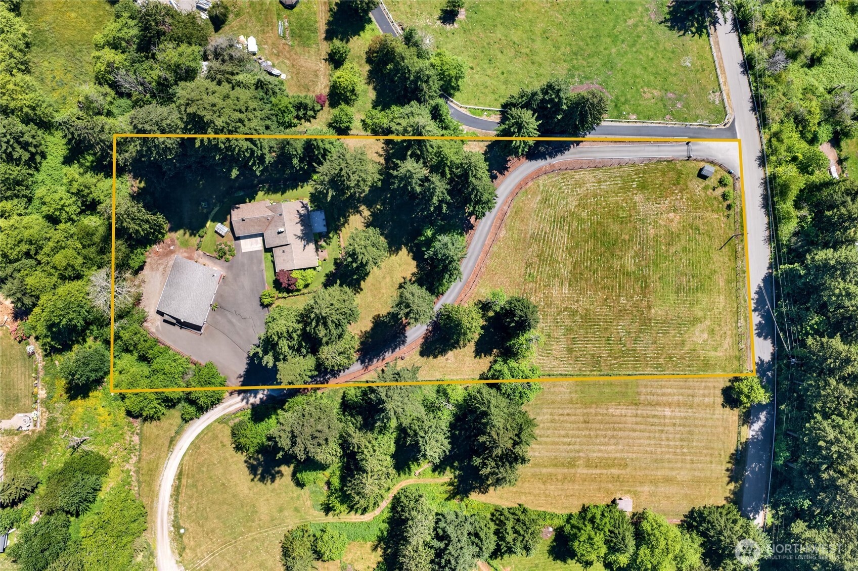 Welcome to this exceptional 3.21-acre farm property where a gated entry welcomes you home to the perfect blend of comfort, functionality, & country charm. Bring your horses, livestock, RV, & hobbies—this versatile property offers the freedom you've been looking for with no HOA restrictions.  The thoughtfully designed 2,300 sq. ft. rambler features an open-concept layout ideal for everyday living & entertaining. French doors open to a large deck overlooking landscaped grounds, creating the perfect setting for gatherings or peaceful evenings outdoors. The kitchen offers abundant cabinetry, solid surface countertops, stainless steel appliances, gas cooktop, walk-in pantry, & convenient pop-up mixer lift. The inviting living room features a cozy gas stove & connectivity to dining & kitchen.  The primary suite offers garden access, views, a private bath with glass-enclosed shower, and walk-in closet. Down the hall find two additional bedrooms & an updated guest bath with walk-in jetted tub providing comfortable accommodations for guests. Recent interior paint & newer carpet add to the home's move-in-ready appeal.  Outside, the heated 3-bay shop offers ample space for projects, equipment, and storage. Equestrian amenities include two stalls, hot-water wash rack, hay or equipment storage, & dog kennel. Additional property features include concrete/tile roof on the home, sprinkler system, generator, greenhouse, mature landscaping, & fruit trees. This property checks all the boxes!