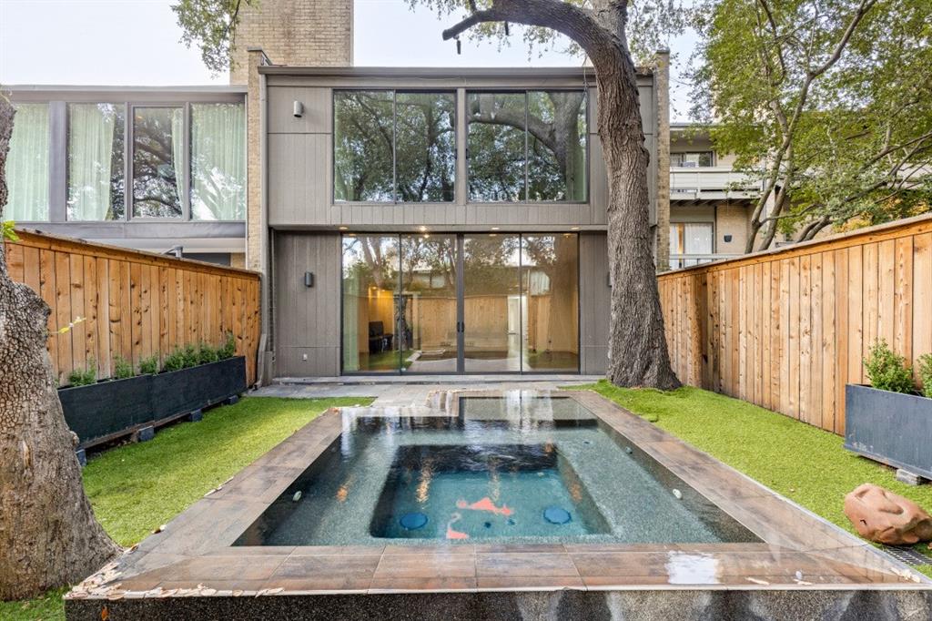 Priced to sell! Rare opportunity to own a beautifully updated Frank Welch townhome just steps from the Katy Trail in the heart of Uptown Dallas. Located on highly sought after Buena Vista Street, this sophisticated residence offers an exceptional blend of modern updates, natural light, and effortless indoor outdoor living. Price drop to account for 20K in floor updates and 20K to update bathrooms, etc. A welcoming foyer opens to a warm and inviting living room featuring abundant natural light and views of the beautifully landscaped private backyard, complete with an in ground heated and jetted spa. The stylish kitchen is designed for both entertaining and everyday living, featuring a spacious island with gas cooktop and a built in refrigerator. Upstairs, the generously sized guest bedroom is complemented by a spacious primary suite with a fireplace and sitting area. Both bedrooms feature floor to ceiling glass doors, filling the spaces with natural light. The attached two car garage includes a dedicated electrical outlet ready for an electric vehicle. Ideally located near a Katy Trail entrance, West Village, Knox Henderson, and Uptown's premier restaurants, shopping, and entertainment, this exceptional home offers the best of Dallas living in a highly desirable location. Come check it out before it's gone!