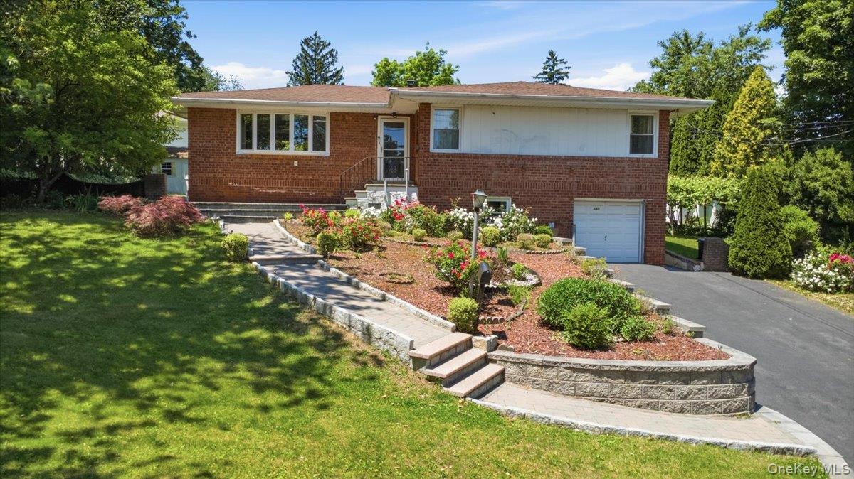 Welcome to this charming Ranch home situated in the highly desirable and tree-lined neighborhood of  CRESTWOOD LAKE in Yonkers, boasting 3 bedrooms and 2.1 bathrooms. This bright and airy property offers a perfect blend of comfort and convenience. The main level features a spacious living area perfect for entertaining, dining room, and an EIK with door to the Patio and backyard. Step outside to a lovely backyard space, ideal for summer barbecues or morning coffee. Perfectly located near parks, shopping, dining, and major highways for an effortless commute into NYC. Lower level (approximately 733 SQFT) with separate entrance is not included in the total SQFT of public records. Taxes do not reflect basic star of $920. Please verify taxes and SQFT before inspection or contract. Don’t miss the opportunity to make 351 Grandview Blvd your new address.