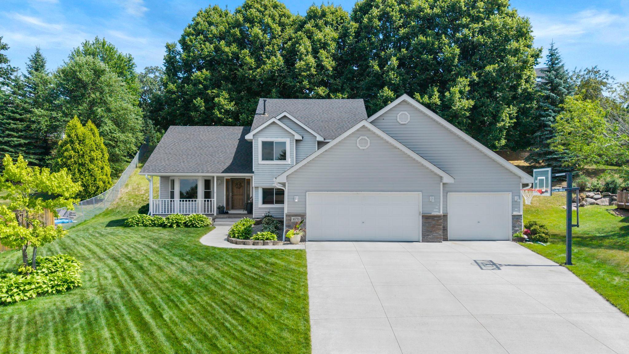 Move right into this beautifully maintained 4-bedroom, 3-bathroom home in a quiet Lakeville neighborhood just steps from Rolling Oaks Park. With easy access to I-35W, downtown Lakeville, Apple Valley, and Burnsville, the location is hard to beat.Inside, enjoy bright, spacious living areas, a welcoming family room with a floor-to-ceiling brick fireplace, and a kitchen featuring abundant cabinetry, double ovens, and a new dishwasher (2024).A versatile main-level bedroom or office, plus a convenient laundry and mudroom, add everyday functionality.Upstairs, the vaulted primary suite includes a walk-in closet and private bath, while two additional bedrooms share a full bath.The finished lower level provides extra space for a rec room, gym, or hobby area with expansive crawl space for storage.Outside, relax in the private backyard with a new deck and patio (2025), mature trees, and hillside views.Major updates include a new furnace and A/C (2026), water heater and softener (2024), new concrete garage floor (2025), roof (2023), and a heated 3-car garage (insulated and finished with new drywall in 2026).