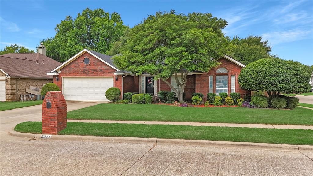 Meticulously maintained single-story with beautiful brick elevation and mature trees! Terrific location in an established Flower Mound community, just walking distance to Marcus HS! Inside you will find 4 bedrooms, 2 full baths, a second living space with cozy fireplace just off the kitchen, and 2-car garage! Upgrades and amenities include gorgeous hardwood flooring throughout main living areas, an abundance of natural lighting throughout, new roof and HVAC in September 2024, neutral paint tones, split secondary bedrooms for added privacy, extensive crown molding, upgraded lighting fixtures, huge living space at the heart of the home, whole home water purification system, and MORE! Spacious kitchen boasts granite countertops with a tumbled stone backsplash, an abundance of bright white cabinetry, stainless appliances including double ovens, an electric cooktop, and cozy breakfast nook. Primary retreat secluded at the rear of the home offers a luxurious ensuite with garden tub, frameless shower, and large walk-in closet with built-ins. Large private backyard with mature shade trees is complete with an expansive covered patio area perfect for entertaining and storage shed!