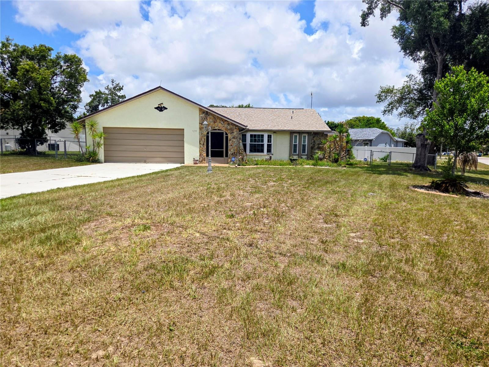 Fabulous opportunity. This 3/2/2 corner lot home is conveniently located near Spring Hill Drive and Mariner Drive. There is a brand new roof, nearly new AC and windows. Move in and enjoy this home on nearly 1/3 acre. The spacious split floor plan has separate living, family and dining rooms. The kitchen has plenty of cabinet space and a large snack bar. The en suite bathroom opens to an enclosed private courtyard. The garage has a workshop and loads of storage space. There is a four zoned sprinkler system. Located convenient to service and transportation this home sits in a quiet and peacefull neighborhood. Hurry in cause this one will not last long!