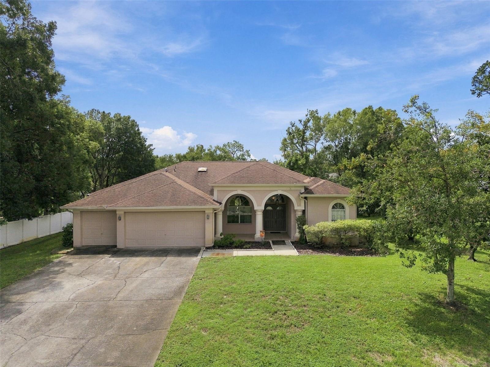 Beautiful Canal-Front 4-Bedroom Home with Pool & Boat AccessWelcome home to this spacious 4-bedroom, 3-bathroom residence with a 3-car garage, ideally situated on a larger-than-usual lot in a quiet, tucked-away neighborhood. Offering the perfect blend of privacy, comfort, and convenience, this property provides a peaceful retreat while keeping you close to everyday amenities, shopping, dining, and entertainment.Outdoor living takes center stage with a newly refurbished inground pool with spa surrounded by pavers and a screened enclosure, creating the perfect setting for relaxing or entertaining. The property is located directly on a canal leading to East Lake, offering wonderful waterfront access and a concrete boat pad  in the side yard for added convenience.The home also features a long list of recent improvements, including a resurfaced pool and deck, upgraded primary and hall bathrooms, new septic drain field and pump, newer water softener, new air-handler fan unit, new refrigerator, and new garage door opener. The roof was replaced in 2015 and inspected following the hurricane in 2024. The dock has also been inspected and repaired, and subterranean termite protection has been in place since 2012.Adding to the property's charm are fruit trees, including avocado, mango, Japanese plum, and Ruby Red grapefruit.With generous outdoor space, waterfront access, a beautifully updated pool area, a 3-car garage, and numerous major improvements already completed, this home offers a rare opportunity to enjoy a private waterfront lifestyle without giving up convenience. It’s the perfect spacious family home so come see it today!
