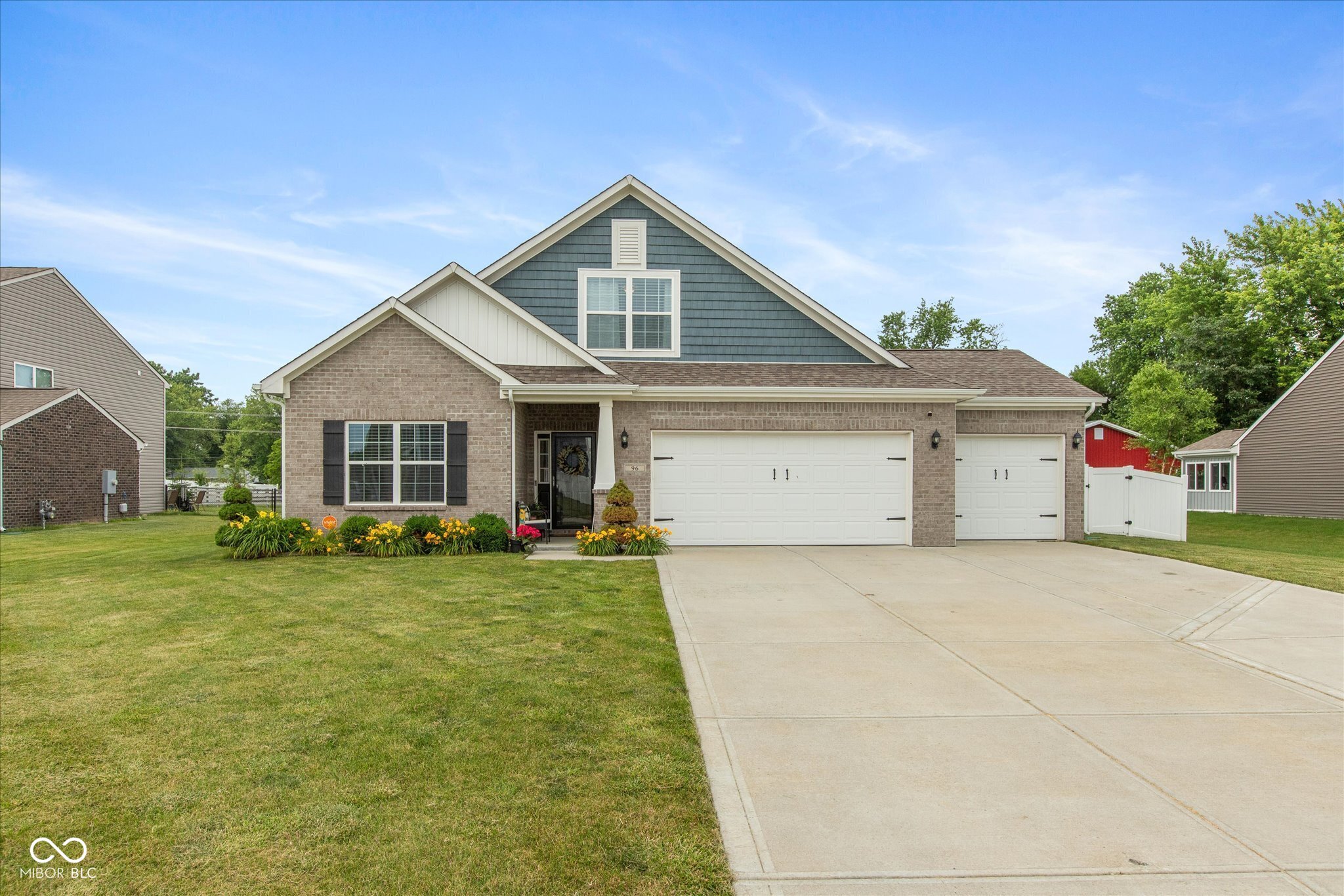Beautifully maintained 4BR/3BA ranch with a 3-car garage in desirable Whiteland. Built in 2018, this home offers an open-concept layout with a bright entry, vaulted great room with fireplace, rich flooring, and abundant natural light. The kitchen is designed for both everyday living and entertaining, featuring granite countertops, a large center island with seating, white cabinetry, stainless steel appliances, subway tile backsplash, and spacious dining area. The private primary suite offers a relaxing retreat with backyard views, dual vanities, and a large tiled walk-in shower. Generous secondary bedrooms provide flexibility for guests, office, or hobby space. Step outside to a standout backyard built for entertaining with a covered patio, expansive concrete surround, in-ground pool, hot tub area, full privacy fence, and open lawn space. Exceptional curb appeal with manicured landscaping adds to the home's charm. Convenient location with quick access to I-65 and US-31, and just minutes from Greenwood, Franklin, shopping, dining, parks, and trails.    For qualified buyers: this home offers the potential for an assumable VA loan currently at 2.6%, creating a unique financing opportunity that may provide significant value compared to current market rates. Buyer must qualify and assume the existing VA loan subject to lender and VA approval. This is a rare chance to pair modern style, functional living, resort-style outdoor amenities, and attractive financing potential all in one exceptional home.