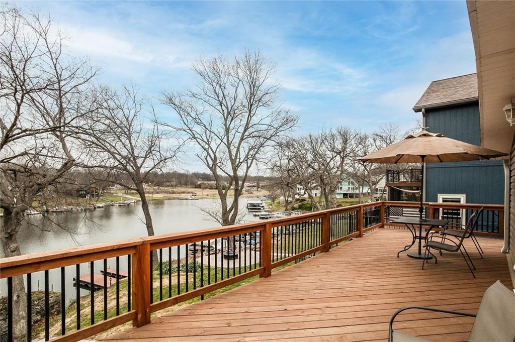 This charming first tier 2 bdrm, 2 full bath Lake Tapawingo ranch has everything you've been looking for! Open concept main level with extraordinary views, updated kitchen with new cabinets, new quartz counter tops and island, full finished walkout basement with office space, full bath, rec room with wet bar and plenty of additional storage! Humongous laundry room! Two car garage (F150 crewcab fits!) and extra parking! You'll love the views from every angel of the wrap around upper deck (new in 25') or below on the terrace!   Sewer line has all been replaced, dock has newer required encapsulated foam, newer decking and manual boat lift stays!  Newer HVAC and water heater. This home has been meticulously maintained, great location, only three tenths of a mile from the entrance.  Ski, boat, tube, fish, you'll fall in love with this gorgeous, private lake community.