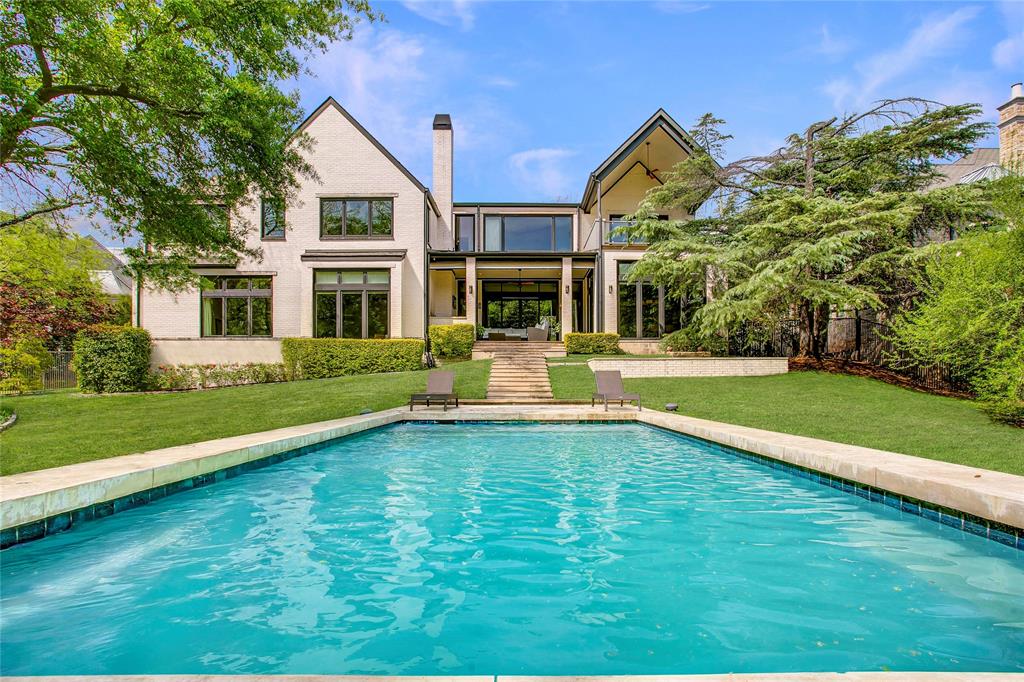 Experience refined modern living in the exclusive gated enclave of Glen Abbey, where this exceptional estate sits on a rare .8-acre cul-de-sac lot backing to a serene creek and lush mature trees.  Built in 2013 by renowned builder Tom Braun and thoughtfully designed in collaberation with architects Robbie Fusch & Billy Ware, this home showcases clean architectural lines and uncompromising quality throughout. pier and beam foundation anchors the residence, while 11-foot ceilings and expansive walls of Kolbe Windows & Doors flood the interiors with natural light and frame tranquil backyard views. The open-concept living area features a striking gas fireplace and seamless flow into a chef’s kitchen appointed with sleek SieMatic cabinetry, premium Miele appliances, and dramatic quartzite waterfall countertops.Thoughtfully designed for both elegant entertaining and everyday comfort, the main level includes formal living and formal dining rooms, a media room, private study, guest suite, and elevator access. Upstairs, the luxurious primary retreat offers a sitting area, private balcony, spa-inspired bath, dual custom closets, and an adjoining fitness room. Three additional guest suites, a spacious game room, second study, and secondary laundry complete the upper level. Outdoor living is equally impressive, with a resort-style pool, sports court, expansive yard, and a fully equipped outdoor kitchen and living area with motorized shades—perfect for year-round enjoyment. Additional highlights include a 3-car garage with epoxy flooring, whole-home water filtration, custom Elfa closet systems, integrated Control4 smart home technology, built-in speakers throughout, Hunter Douglas shades, rich tigerwood plank flooring, and minimal carpet limited to the media room. A rare offering that combines sophisticated design, superior craftsmanship, and an unparalleled setting—this home defines modern luxury living.