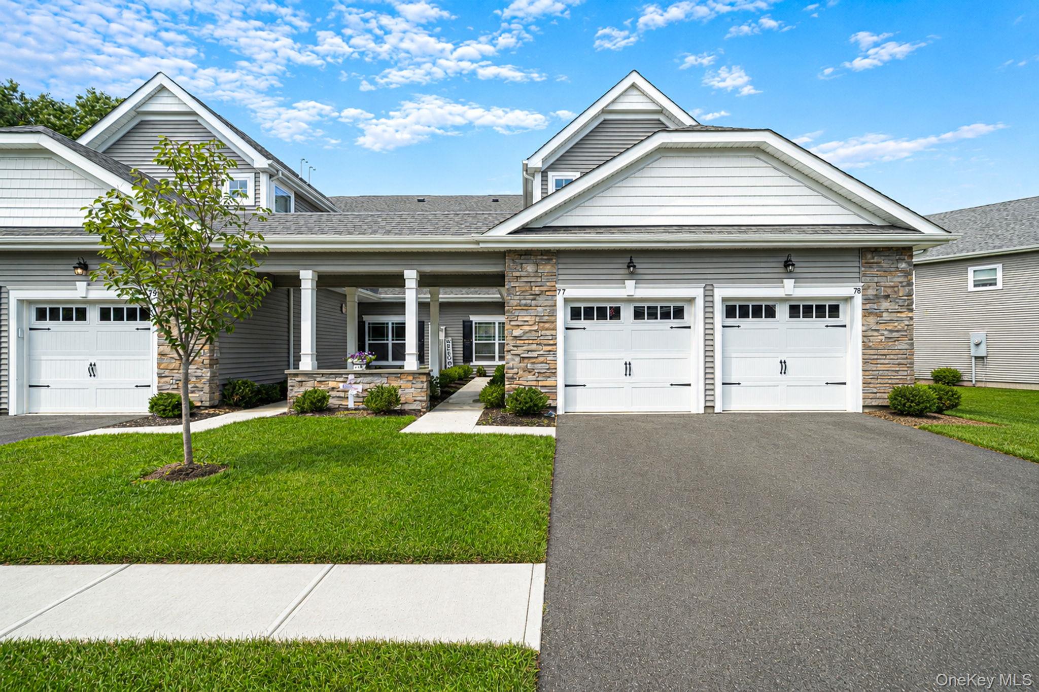 Experience luxury, security, and effortless first-floor living in this pristine, only one-year-old ENERGY STAR rated condo tucked away inside a beautifully landscaped, gated community of Willow Wood.Built just a year ago, this home offers the feel and peace of mind of brand-new construction. Boasting airy 9-foot ceilings and streaming natural light, the open-concept layout features a cozy living room anchored by a warm gas fireplace. The kitchen is a true showstopper, meticulously designed with deluxe decorator Birch White cabinetry, premium granite countertops, and upgraded, near-new GE appliances. Retreat to the spacious primary suite, complete with a massive walk-in closet and an ensuite bathroom featuring a double sink vanity, and a spacious walk-in shower. A generous second bedroom and a second full bathroom offer the perfect setup for guests or a home office.Step outside past your energy efficient windows to your custom, oversized patio. This is an ideal oasis for morning coffee or outdoor entertaining. This modern home also includes a spacious attached 1-car garage and an upgraded 150-amp electrical service.Resort style living is right outside your door. The exclusive gated community features a premier clubhouse with a fully equipped exercise room, a sparkling in ground pool, basketball and tennis courts, a playground, and a shaded picnic area. Enjoy premium upgrades, energy efficiency, and a maintenance-free lifestyle in a prime location. Don't miss out on this unique opportunity!