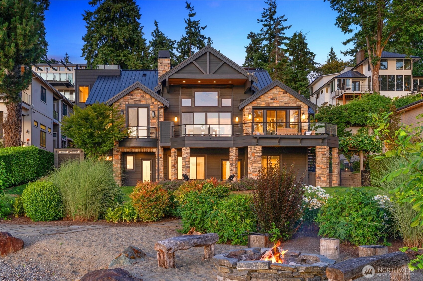 An extraordinary waterfront estate on over an acre in Kirkland’s coveted West of Market. This timeless property boasts 90’ of no bank Lake WA shoreline, an expansive emerald lawn and a 94’ dock with boat lift. The 5,180 sf oasis includes a 3 bed, 2.75 bath main home and a 1 bed, 1 bath guest cottage—perfect for hosting or multi-gen living. Exceptional craftsmanship throughout, featuring a main floor primary suite, Thermador kitchen, wine cellar, heated floors & an oversized 3-car garage. Enjoy sweeping lake, city & mountain views. A sprawling deck, built-in BBQ & fire pit at the water’s edge invite unforgettable sunsets, s’mores & relaxed lakeside living. Minutes to parks, DT Kirkland and LW schools. A one-of-a-kind legacy for generations.