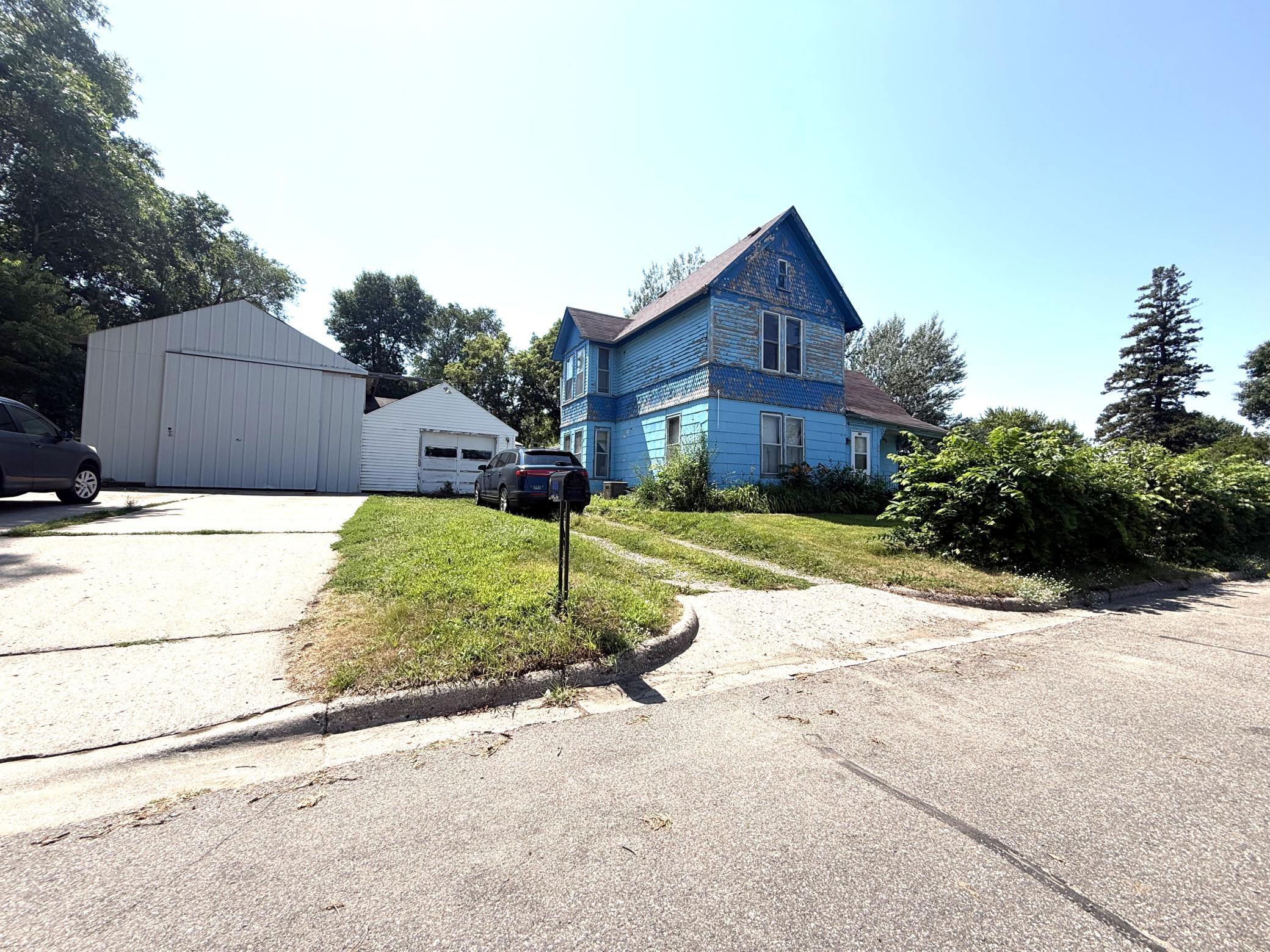 Handy person special! Great opportunity for the skilled investor! Situated on 4 city lots near the bike trail. Almost an acre! The house needs lots of repairs and updating.  As Is addendum required. Newer water heater and furnace.