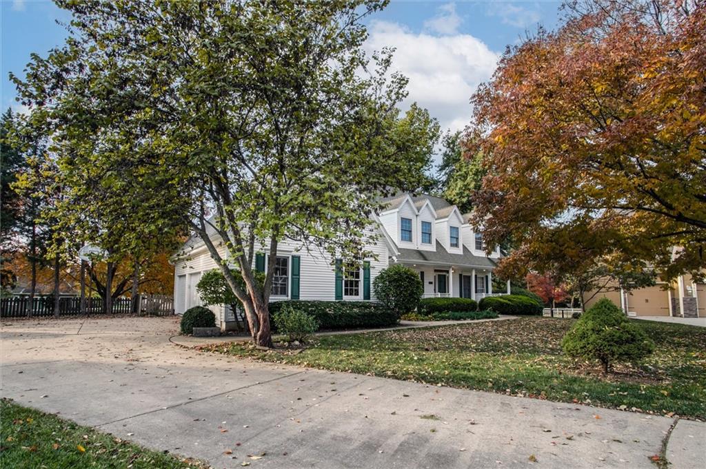 Welcome to this enchanting home straight out of a movie!  A 4-bedroom, 3.5-bath Colonial where timeless charm and modern comfort meet.  From the moment you arrive, you’ll be captivated by the home’s stately presence, mature trees, and the feeling that you’ve stepped back into a simpler, more graceful time. Inside, wood floors flow through much of the main level, leading you through warm and inviting spaces. The custom-paneled study with built-in cabinetry offers a perfect retreat for work or reflection.  Enjoy cozy evenings by one of two brick wood-burning fireplace, one in the great room and the other in the hearth room.  Upstairs double doors welcome you to an expansive primary with a generous bonus room ideal for a second office, dream closet, or even an additional laundry area   The secondary bedrooms are thoughtfully designed, one with its own private bath, while the others share a convenient Jack-and-Jill.  The front bedrooms charm with classic dormer windows featuring cozy built-in seating, perfect for reading or relaxing. The unfinished lower level offers over 1,600 sq. ft. of potential for future expansion—family room, home theater, entertaining or hobby space, the possibilities are endless.  Outside, a spacious fenced backyard offers privacy and charm, complete with a garden area ready for your green thumb, a deck for entertaining.  Nestled in a storybook Lee’s Summit neighborhood known for its character and community, this home offers convenient access to shopping, highways, lakes, and all that Lee’s Summit offers.  It combines classic character with endless possibilities. Bring your vision and make this storybook Colonial your forever home!