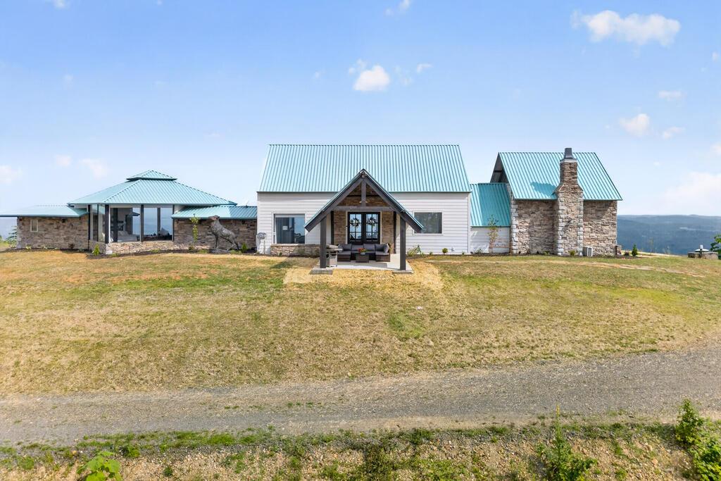 Perched atop more than 25 private acres, this stunning 2,510-sq ft Elk Mountain Retreat offers an unparalleled mountain living experience. Thoughtfully renovated with high-end finishes throughout, the home is perfectly positioned to capture breathtaking 360-degree views of rolling mountain ranges, spectacular sunrises, and unforgettable sunsets. Expansive walls of glass blur the line between indoors and out, immersing every living space in the beauty of the surrounding landscape. Designed to comfortably accommodate up to eight guests, this exceptional property is equally suited as a full-time residence, luxury vacation home, or private mountain escape. Enjoy complete privacy and tranquility while remaining conveniently close to outdoor adventures, including the New River, the scenic New River Trail, Shot Tower State Park, and easy access via Highway I77. Here, the soundtrack is nature itself with gentle mountain breezes, native wildlife, and peaceful silence. Shown by Appt only.