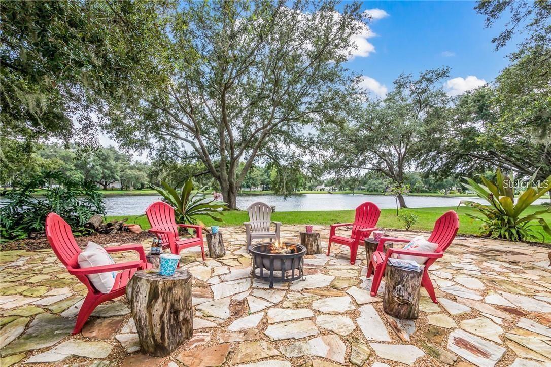 One or more photo(s) has been virtually staged. Must See, Move-In Ready Spectacular Lake & Garden View Florida Oasis! Spacious 4 Bd + Flex Room, 3 Bath, 3 Car Garage, SFH sits on Fully Irrigated .51 Acre Lot, Nestled in Tranquil Park Like Setting of Highly Desirable Country Creek w/ A-Rated Lakewood Ranch Schools. Location, Luxury & Condition Set this Gem Apart! Completely Upgraded to Highest Luxury Standards (2015-2025), Tastefully Updated w/ Attention to Details & Meticulously Maintained w/ Pride of Ownership. Striking Curb Appeal w/ Distinctive Taste Inspired by Lavish Mediterranean Villas, Limestone Accent Walls, Architectural Moldings, French Chateau’ Lightings, Extra Large Driveway & Professionally Designed Landscaping. New Shingle Roof (2021), 6” Gutters/Downspouts w/ Leaf Guard & Buried Pop-Up Drains provide Peace-of-Mind & Ease of Maintenance. Expansive Covered Front Porch, Rear Lanai & Waterfront Backyard host Hummingbirds, Blue Jays, Red Robbins, Hawks, Woodpeckers & Butterflies in Year-Round Blooming Florida-Friendly Low-Maintenance Butterfly & Rock Gardens w/ Tropical Palms, Bird of Paradise, Hibiscus, Desert Rose, Pineapples & Succulents. Brick Paved Walkway leads to Grand Double French Door Entry secured w/ Lockly Elite Video Smart Lock w/ Camera, Wi-Fi, PIN Genie® Keypad, No Monthly Fee Remote Control App & 2 Way Audio Doorbell. Impressive Soaring High 12’ Ceiling Foyer & 14’ Cathedral Ceilings in Formal Living & Dining Rooms where Extraordinary Expansive Lake & Garden View Takes Your Breath Away! New Nucore 8mm High Performance Luxury Vinyl Flooring in Formal Living & Dining, All Secondary Bedrooms & Flex Room (2025) is Water/Pet Proof, Extreme Scratch/Dent Resistant & Easy-To-Clean. Designer High-End Gourmet Kitchen is Chef’s Delight w/ Double-Stacked 65” Upper Cabinets w/ Glass Doors, Soft Close Solid Wood Cabinetry, Top of the Line Kitchen Aid Appliances, Large Island, Extra-Large Breakfast Bar, Italian Hardware, Walk-In Pantry, Inside/Under Cabinet LED Lighting, Hidden Electric Outlets, Glass/Marble Backsplash & Gorgeous Floor to Ceiling Feature Wall. Unobstructed View of FL Great Room, Pool/Spa, Garden & Lake from Kitchen & Breakfast Nook. 4 sets of Sliding Glass Doors spell Ultimate Indoor-Outdoor FL Living Experience. Split Floor Plan offers Privacy & Functionality. Master Bedroom Suite in front of home w/ Coffered Ceiling, 2 Large His & Her Walk-In Closets, View of Tropical Haven & a Luxury Spa Bathroom w/ Dual Sinks, Garden Tub, Separate Vanity & Spacious Walk-In Roman Shower w/ Fresco Rain/Body Shower System, 5.5’ Carrara Marble Bench, Glass & Marble Mosaic Tiles & Frameless Glass Enclosure is Fit for Royalty. Largest Secondary Bedroom serves as 2nd Master in rear of the property w/ Dedicated Bathroom opening up to Pool & Backyard. Huge Flex Room w/ Sliding Glass Door leads to Great Outdoors w/ Full View of Lakeside Backyard Oasis. This wing can serve as a Mother-In-Law Suite. 3rd wing boasts 2 Bedrooms & 3rd Luxury Bathroom w/ Tub & Shower. Brick Paved Pool Deck, Caribbean Blue Pebble Tech Salt-Water Heated Pool w/ Iridescent Glass Tiles, Multi-Color LED Pool Lighting, HotSpring Spa, Night Blooming Jasmine & Expansive 180 Degree Lake/Garden View make an Exceptional Lanai. 109’ Paved Pathway from Pool Cage to Impressive Serene Lakeside Flagstone Area w/ Spanish-Moss-Covered Mature Florida Oak Trees swaying in Subtle Gulf Breeze Reminiscent of Elegant Old Florida. Home Warranty until Dec 30, 2026. Seller is Listing Agent & Licensed Florida Realtor.