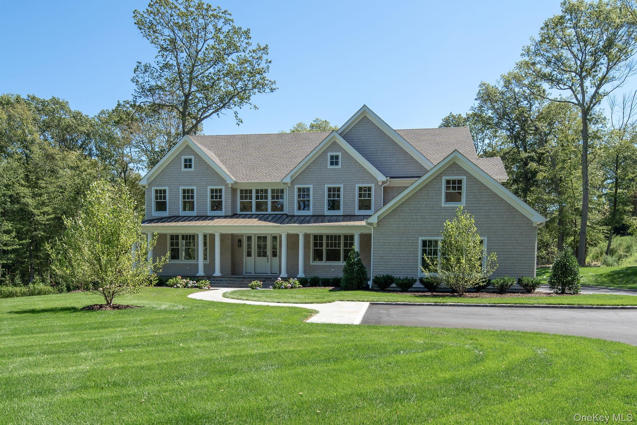 Welcome Home! Set in the heart of prime Cold Spring Harbor, this brand-new, custom residence offers 6,500 sq. ft. of modern luxury on 2 beautifully landscaped acres. Exceptionally designed with today’s lifestyle in mind, the home features 6 bedrooms, 6.5 baths, and stunning architectural details throughout.
The primary suite is a true retreat with dual walk-in closets and a spa-inspired bath complete with radiant heated marble floors, soaking tub, and custom shower. The chef’s kitchen stands out with Thermador stainless steel appliances, a quartz center island, and a butler’s pantry with wine cooler. The open floor plan flows seamlessly into the great room —perfect for both everyday living and entertaining. The wide-plank white oak floors run throughout the home elevating each space and bringing together the sophisticated details of this home. A first-floor bedroom with full bath and direct access to the yard adds additional flexibility. 
The expansive finished lower is designed for recreation and wellness with space for a home theater, gym and entertaining. Smart home wiring, a whole-house generator, and 3-car garage with EV charger hookup add to all the modern conveniences this home has to offer. Outdoors, the property is enhanced with bluestone walkways, Belgium block curbing, in-ground sprinklers, and lush landscaping.
Just minutes from Huntington Village, Cold Spring Harbor shops and dining, the train, and top-rated schools, this home delivers both luxury and lifestyle in one of Long Island’s most coveted communities. Cold Spring Harbor School District #2. Eagle Dock Beach and Mooring (dues).