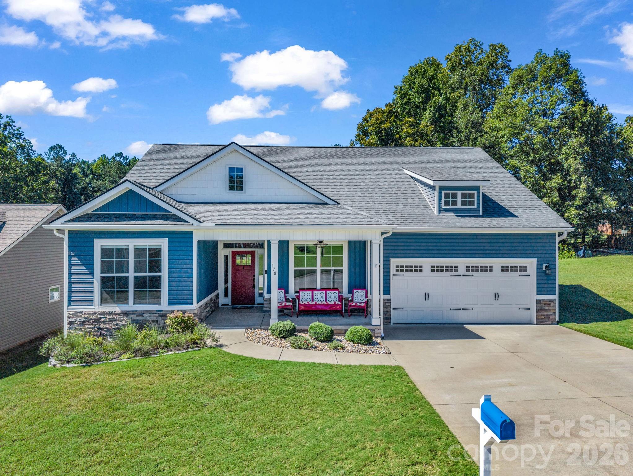 Welcome to 178 Page Creek Blvd in Landrum, SC. Built in 2020, this one-level home offers 3 bedrooms, 2 bathrooms, and approximately 1,670 square feet of living space. A covered front porch welcomes you inside, where the open floor plan connects the kitchen, dining, and living areas. Tile and wood flooring run throughout, while leathered granite countertops give the kitchen a distinctive finish.The spacious primary suite features a tray ceiling, walk-in closet, and private bath. Two additional bedrooms offer space for guests, a home office, or hobbies. At the back of the home, a screened porch and deck extend the living space outdoors. Enjoy a quiet morning on the porch, gather with friends on the deck, or make use of the fenced backyard.An attached 2-car garage provides parking and storage. The home has natural gas, county water, and county sewer. Situated on a 0.17-acre lot in a gated community with a pool, it offers one-level living with convenient access to Landrum and I-26.