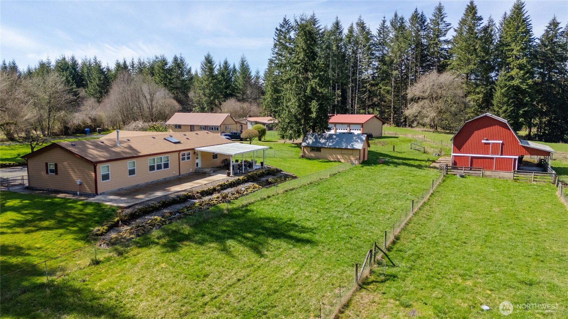 This 3 bed 2 bath home on a 40+/- acre farm is ready for your critters! So much to go over so let's start with the outbuildings! Run your own business or convert to a MIL suit the office space with a bathroom & full laundry hook-ups. Use your imagination for the covered area behind the office/MIL suit that can be set up for many different types of barnyard friends. 3-bay 30x48 shop with working bay is fully insulated & sheeted. Head down to the traditional style barn that is picturesque. Barn has poured concrete floors with stalls & full loft for hay. Lean-to off the side for parking the tractor under cover! Even the shed has power & is insulated! Mature orchard, green pastures, reprod trees & cross fenced fields makes this place special.