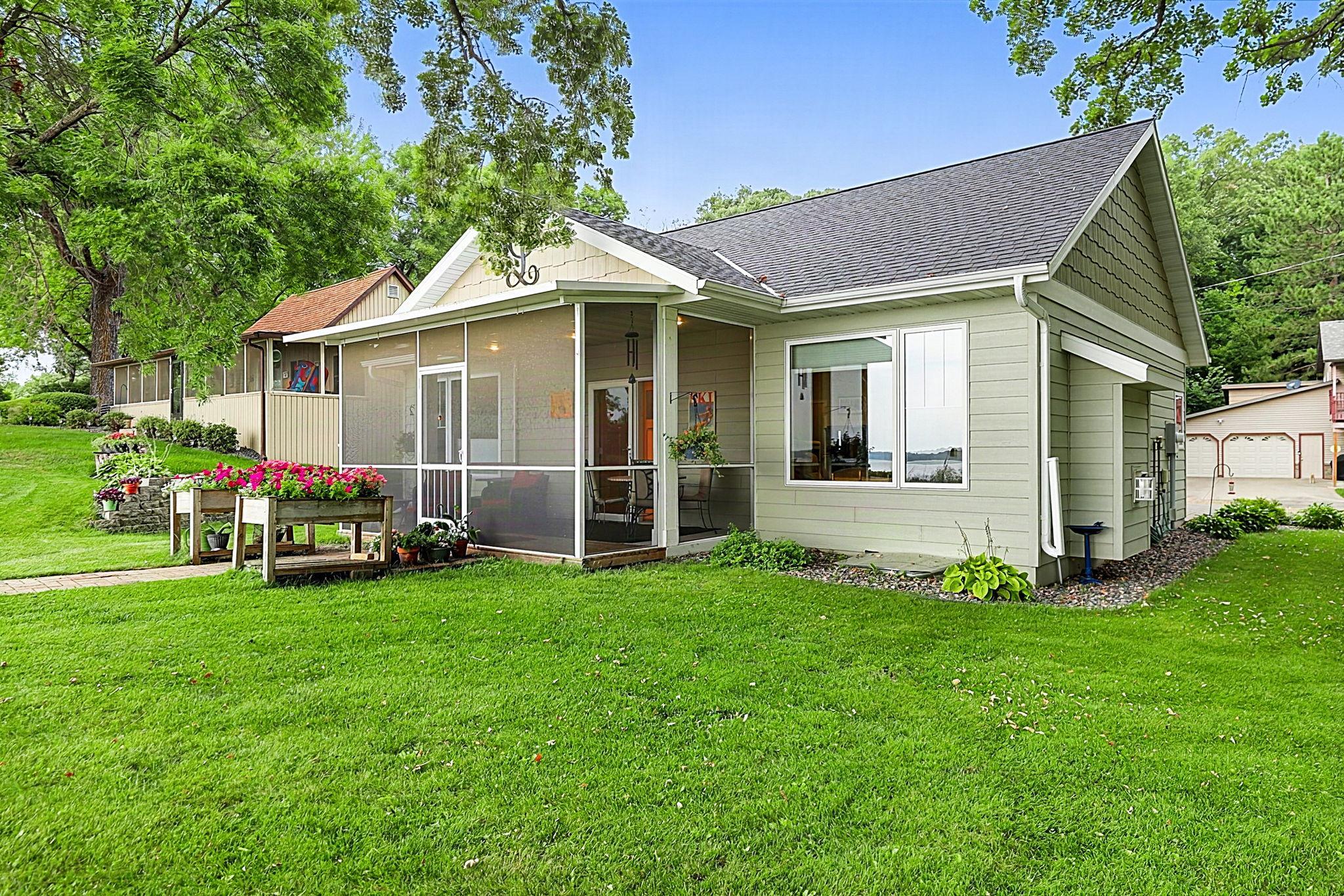 Spectacular Lake Koronis and First Island views are beautifully framed by large, south-facing picture windows in this one-level gem! Designed with accessibility in mind, the home features zero-step entry and convenient one-level living. The open-concept kitchen, living, and dining areas feature 9' sidewalls and an abundance of windows, filling the space with natural light. The kitchen offers custom cabinetry, granite countertops, and stainless steel appliances for a high-end feel. A gas fireplace and main-level in-floor heat add warmth and comfort. A built-in desk and workstation provide a convenient home office area. The primary bedroom features stunning lake views, a 3/4 bath with a urinal, and a walk-in closet. The lower level offers a spacious family room, full bathroom, and additional bedroom, along with in-floor heat for year-round comfort.Additional features include in-floor heat in the garage and durable LP SmartSide siding. The property offers 62 feet of Lake Koronis frontage—Stearns County's largest lake, known for excellent fishing, recreation, and parks. Golf courses, restaurants, breweries, grocery stores, fitness centers, bowling, and more are all conveniently located nearby.Don't miss this thoughtfully designed, efficient Lake Koronis property—schedule your private showing today!