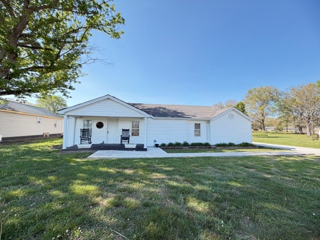 Step into the warmth and character of this charming older home, where timeless details and a welcoming feel make you instantly feel at home. Featuring 2 bedrooms and 2 baths. One bath handicap ready. Nestled just minutes from the heart of town, you'll enjoy the perfect blend of peaceful living with easy access to shopping, dining, and everyday essentials. Outside the property truly shines with a beautiful well-kept yard-ideal for relaxing evenings, weekend gatherings, or simply enjoying a little extra breathing room. Need space for hobbies, storage, or projects? You'll love the detached 2-car shop. With plenty of concrete parking, giving your room for multiple vehicles, guests, or even you boat or RV.