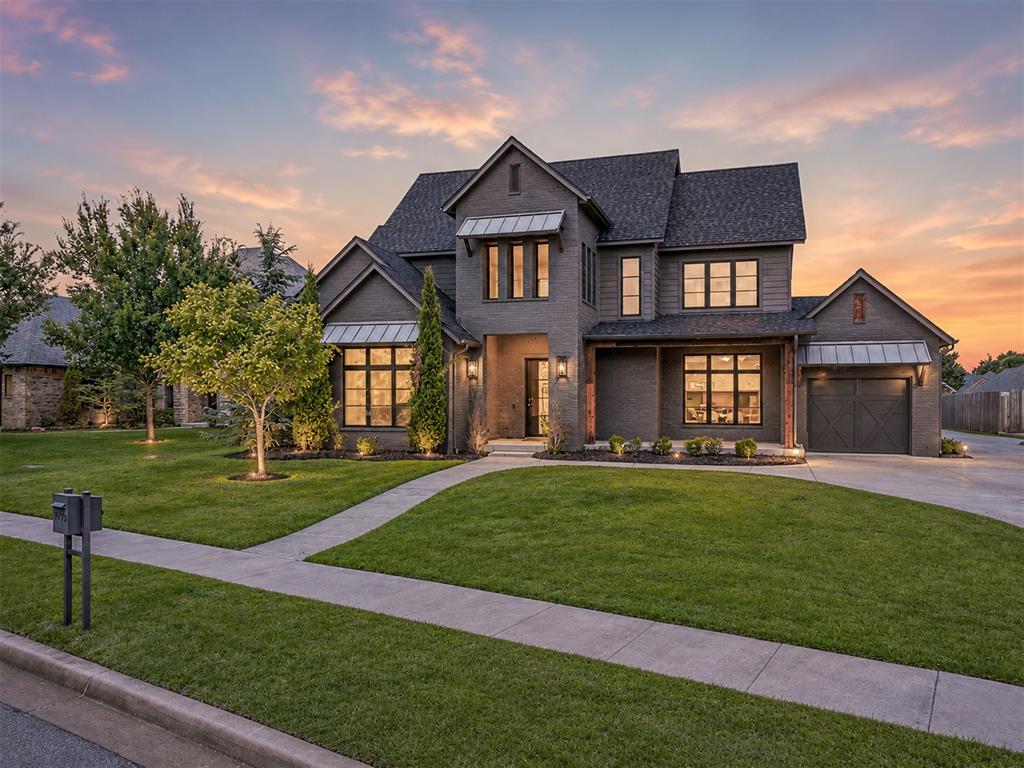 Welcome to Carrington Place, where modern farmhouse style meets spacious, thoughtfully designed living. From the moment you arrive, the beautiful landscaping and inviting covered front porch create the perfect first impression—just waiting for a porch swing and your morning coffee. Inside, a grand entry opens to a light-filled living room where a sleek linear fireplace and custom built-in bookcases create a stunning focal point. The open layout makes entertaining effortless, flowing into a chef’s kitchen featuring KitchenAid appliances, a farmhouse sink, oversized island, gas cooktop, double ovens, and a beverage bar with a wine fridge. The primary suite is a peaceful retreat with oversized windows that flood the room with natural light. The spa-inspired en suite offers abundant storage, an oversized walk-in shower, and an impressive walk-in closet that conveniently includes a built-in safe room for added peace of mind. Upstairs, you’ll find the perfect hangout with a second living area, wet bar, and a private guest suite with its own en suite bath. Every detail was designed with everyday living in mind, from the oversized laundry room with built-in storage and utility sink to the convenient mudroom that keeps life organized. Step outside and you’ll discover one of the home’s best features—a large covered back patio that’s ready for everything from football Saturdays to summer cookouts, complete with direct access to a guest bath for added convenience. Living in Carrington Place means more than owning a beautiful home. Enjoy neighborhood ponds, parks, a clubhouse and pool, pavilion, basketball court, and baseball/soccer field—all just minutes from everything Norman has to offer. Homes with this combination of style, space, and amenities don’t come along often. Schedule your private showing today!