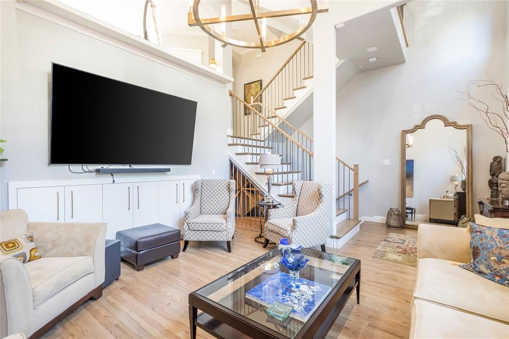 Experience WALKABLE elevated living in the heart of Plano, just minutes from Legacy West, The Shops at Legacy, and major corporate campuses, including Toyota North America, Liberty Mutual, and JPMorgan Chase.  WALK TO SOME OF THE BEST RESTAURANTS, COFEE SHOPS, BARS AND ENTERTAINMENT - A RARE AMENITY IN THE PLANO-FRISCO AREA.This fully upgraded 3-bedroom, 2.5-bath luxury townhome offers a rare combination of modern design, smart functionality, and low-maintenance convenience—ideal for executives and professionals seeking proximity to work, dining, and entertainment.Inside, you’ll find light-filled, open-concept living spaces with hardwood flooring throughout and thoughtfully curated designer finishes. The main living area flows seamlessly into a chef’s kitchen designed for both everyday living and entertaining, featuring an oversized waterfall island, professional-grade double oven, 6-burner gas range, multiple refrigeration units, and custom cabinetry with integrated lighting and hidden outlets.The spacious primary suite offers a private retreat with a large walk-in closet and a spa-inspired marble bathroom complete with a frameless glass shower. Secondary bedrooms are generously sized, each with access to full baths, providing flexibility for guests, home office use, or additional living space. A dedicated laundry area with built-in storage adds to the home’s functionality.Additional highlights include smart home integration for lighting and media, custom designer fixtures throughout, and extensive storage solutions across all levels. The garage is fully upgraded with premium flooring, built-in cabinetry, BIKE RACKS and EV charging capability, along with LARGE storage space.