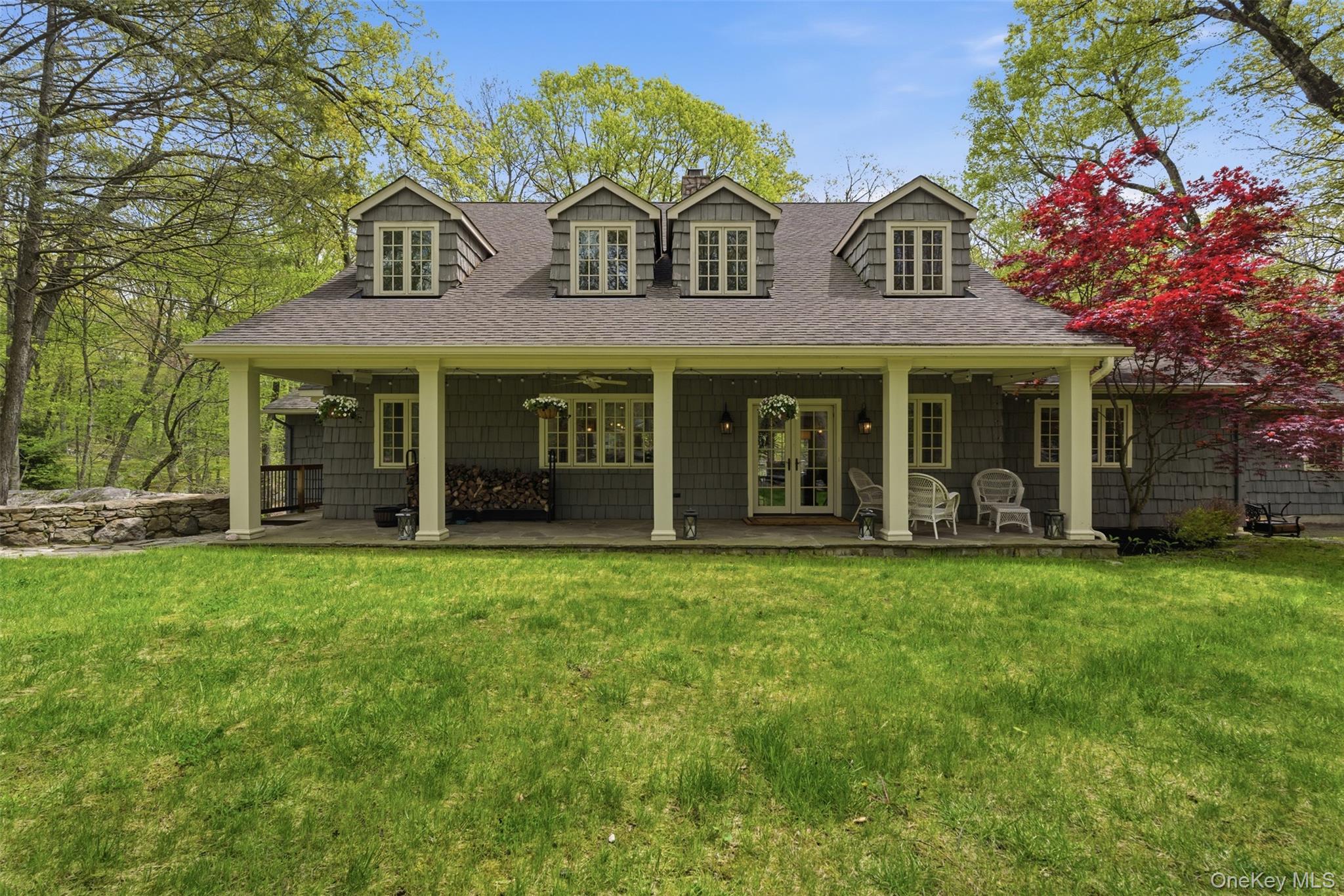 Calling all nature lovers! This award winning (American Institute of Architects Design Award) farmhouse, is a woodland paradise. Set at the end of a private road, with stone outcroppings and it's own mini trail system, this is a quiet retreat with all the updates. An entertainer's dream; this home is equipped with a chef's kitchen featuring custom cabinets, vaulted ceilings, a new butcher block island, and both a front porch and back deck. Oversized windows create natural light and stunning views throughout. This spacious interior creates ultimate flexibility. With the first floor en-suite opening to a stone patio, and the second level primary featuring custom walk in closets, and updated spa bath. This feels like a 5 bedroom (or more). Additional features include: The lower level with a walk-out, two laundry options, and multiple flex spaces. It is ready for what you need.  Recent updates include: Whole house automatic generator, new hot water tank, water filtration systems, new HVAC system, exterior lighting, and a brand new driveway with ample parking.