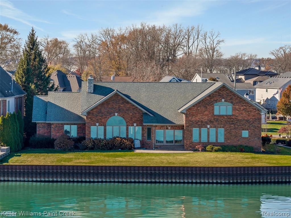 Welcome to a rare opportunity on Lake St. Clair. With 112 feet of water frontage, over 200 feet of depth, and a modern home built in 2016, 37580 Lakeshore offers the kind of waterfront lifestyle and usable square footage that rarely come to market. Whether you picture sunset dinners by the water, weekends on the boat, or hosting unforgettable gatherings, this property was built to make it happen. Inside, the spacious split-ranch design features hardwood floors, generously sized rooms, and an easy flow for everyday living and entertaining. The stately brick exterior delivers curb appeal, while the heated 3-car garage is ideal for vehicles, lake toys, and hobbies. Upstairs, a massive flex space offers room for a game room, guest suite, lounge, or additional bedroom. The finished attic, previously used as a workshop, adds even more potential for a studio, office, fitness space, hobby room, or retreat. For the buyer who recognizes the value of rare frontage, modern construction, and exceptional square footage, this property offers the chance to personalize a truly special waterfront home on Lake St. Clair. This is more than a waterfront home. It is a rare opportunity to create an estate-style lifestyle property tailored to your own vision. Contact your agent to schedule a private showing today.  Note: Seawall updated in 2017.  Prior to the update there was a dock and and a boat well on site.