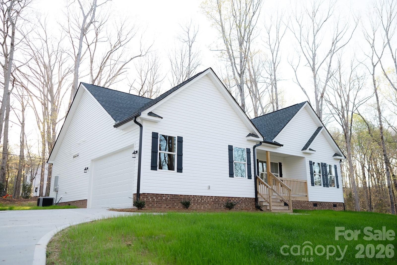 New Home Outside the City Limits. Wooded Lot. 3 Bed 2 Full Bath. Low Maintenance LVP Flooring. Open Concept and Split Bedroom Plan. Primary Bedroom Has Walk In Closet and Double Vanity. Concrete Driveway and Fully Finished Garage with Opener. Covered rear porch. Minutes to I77.